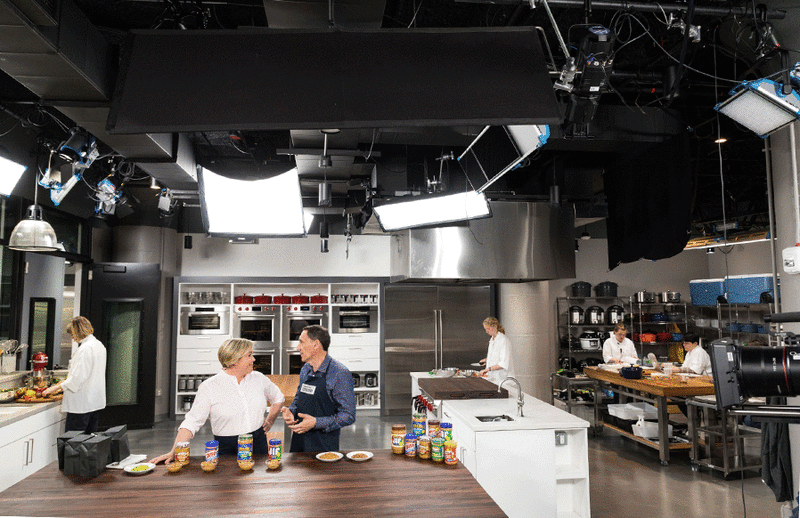 Julia Collin Davison and tasting expert Jack Bishop chat before filming a segment on peanut butter in our new set in Boston's Seaport district.