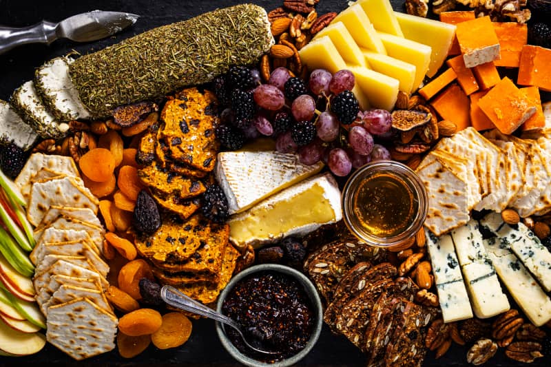 Close up of cheese and fruit on a cheese board