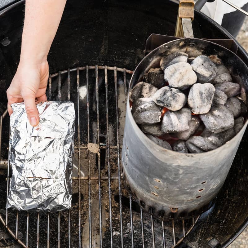 Placing A Foil Packet On Half The Grill