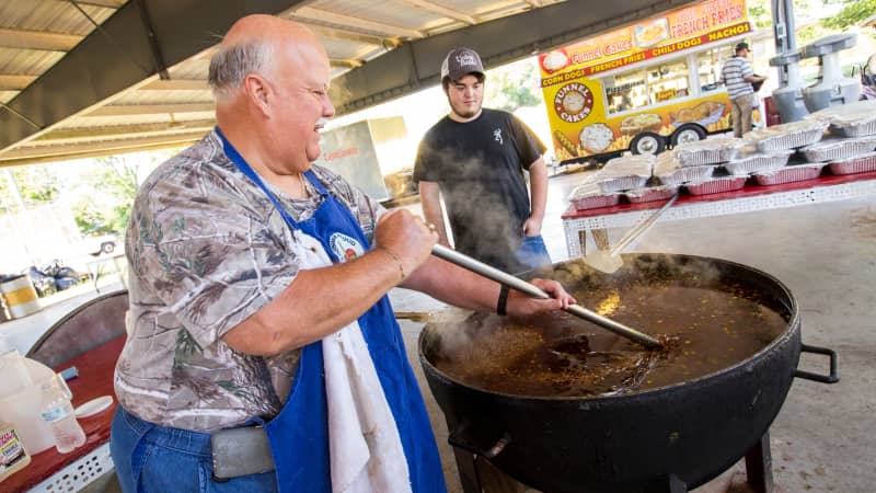 Stirring stew at the Cochon de Lait Festival