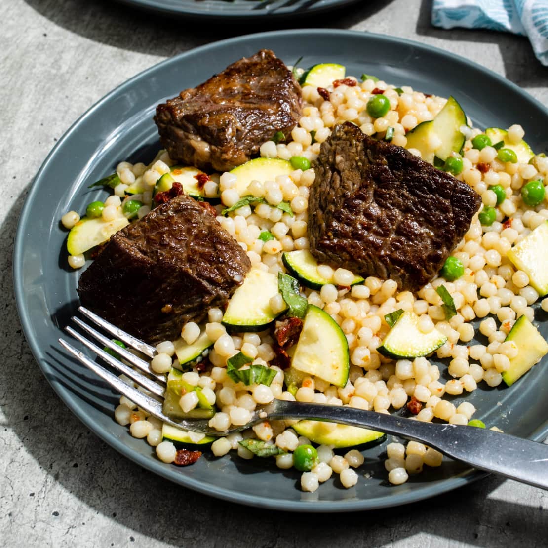 Lemony Steak Tips with Zucchini and Sun-Dried Tomato Couscous