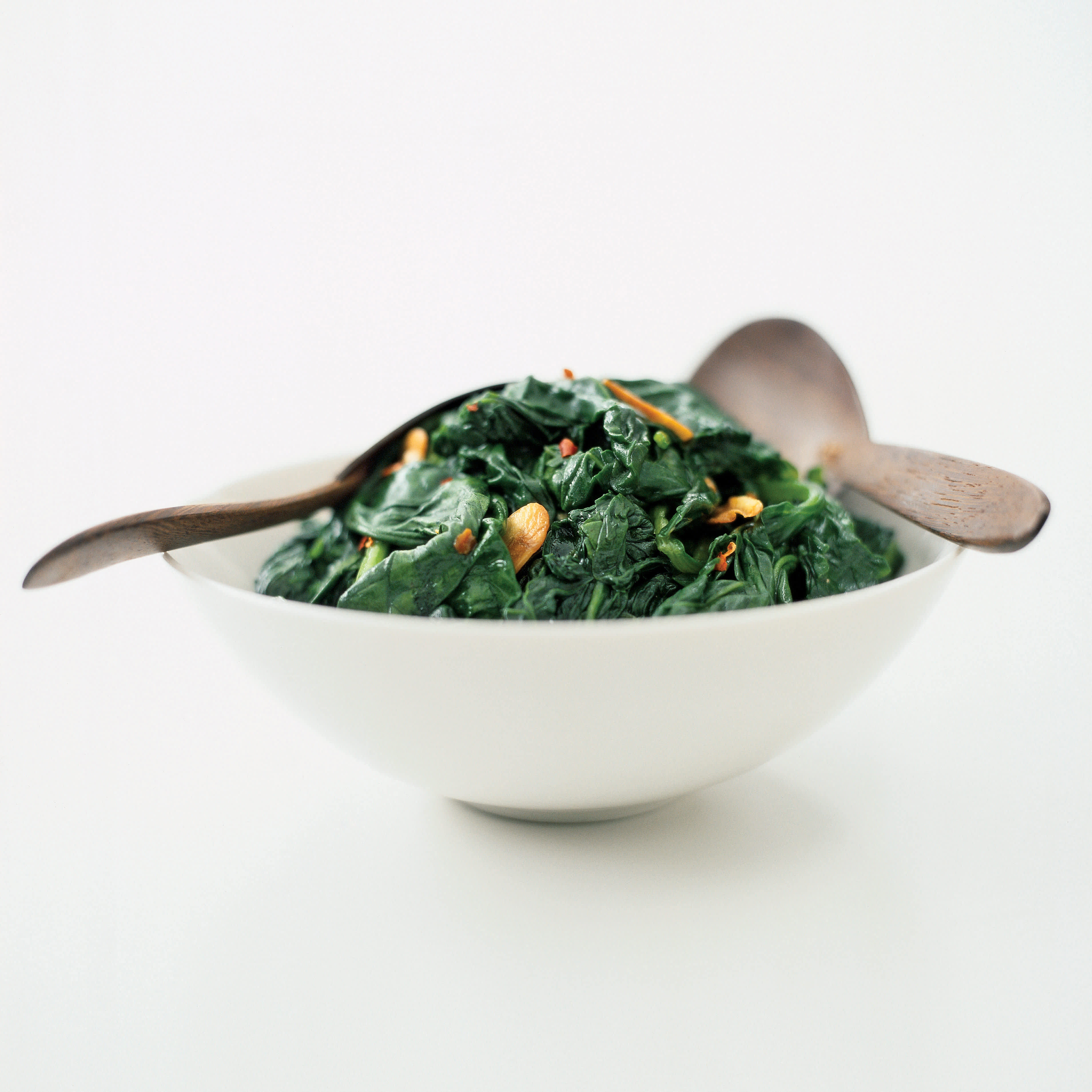 Sauteed Spinach with Almonds and Golden Raisins | America's Test Kitchen