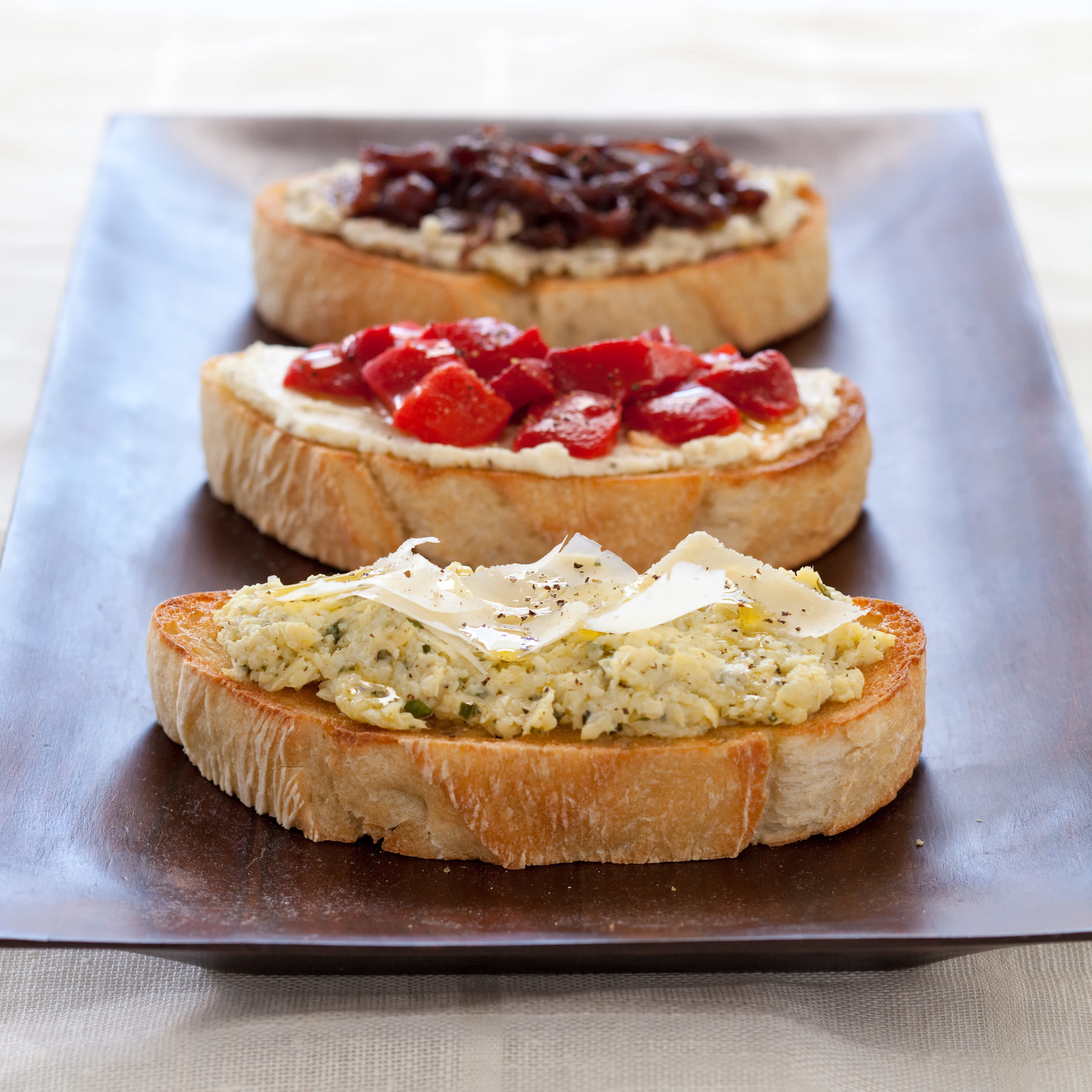 Bruschetta with Black Olive Pesto, Ricotta and Basil