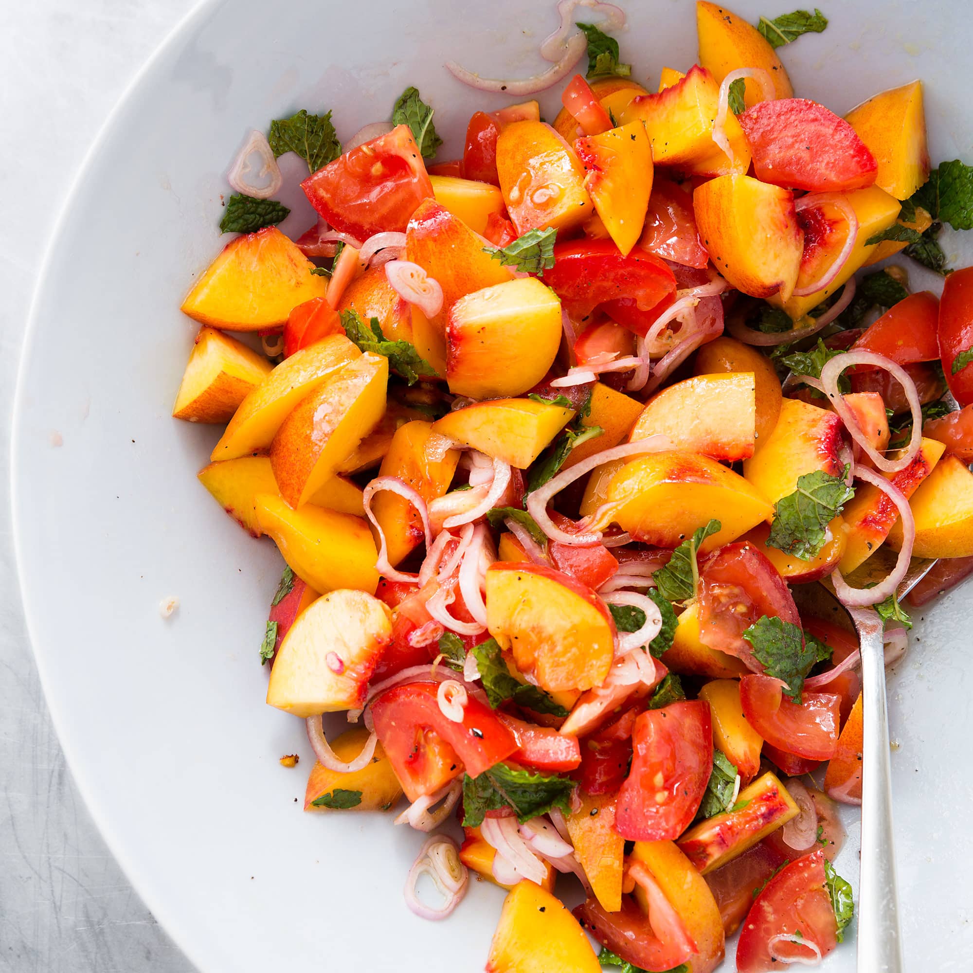 Peach and Tomato Salad with Pancetta and Basil | America's Test Kitchen