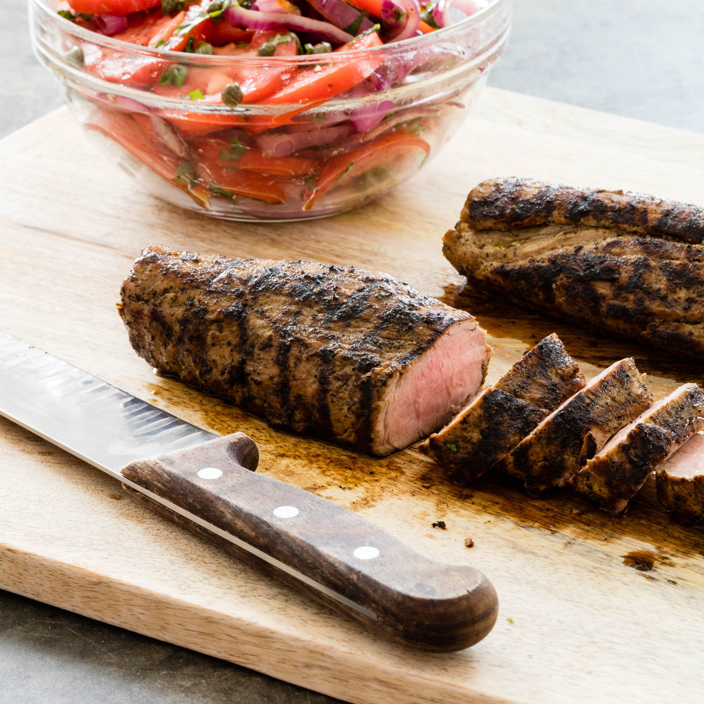 Grilled Pork Tenderloin with Tomato-Onion Salad | America's Test Kitchen
