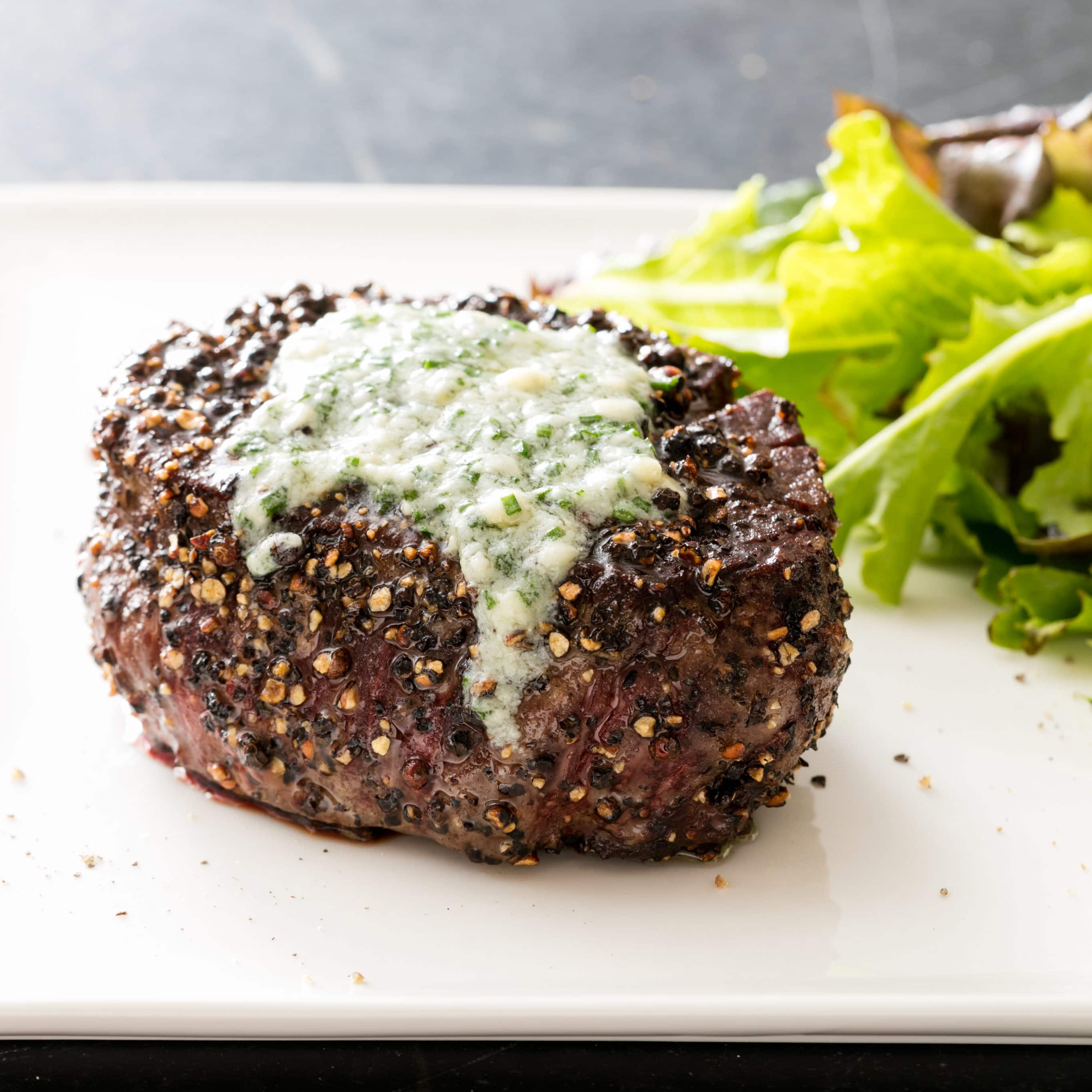 Pepper-Crusted Filet Mignon with Blue Cheese Chive Butter