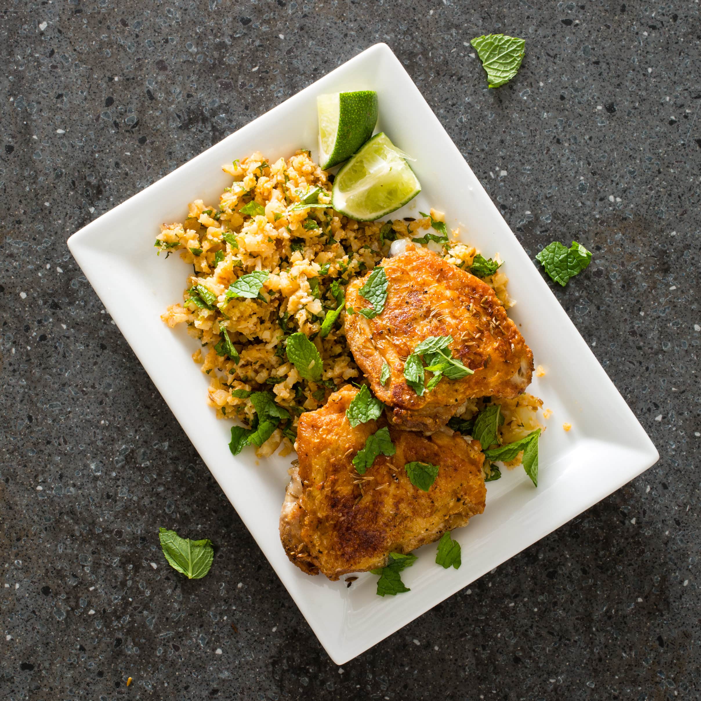 Cumin-Crusted Chicken Thighs with Cauliflower “Couscous” | America's Test Kitchen