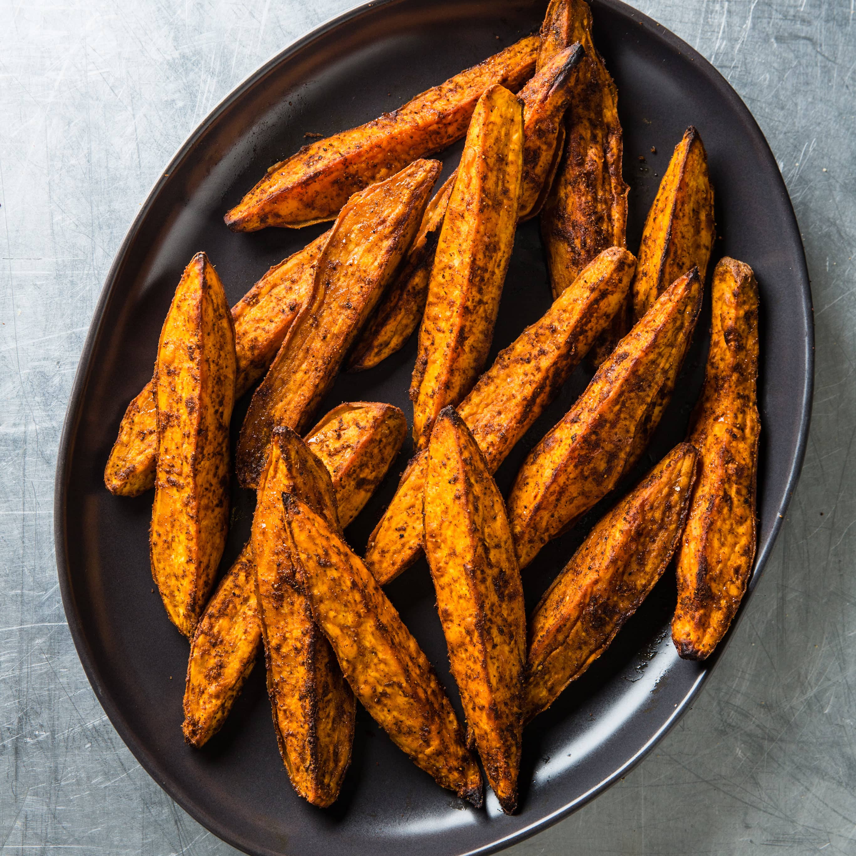 Cumin and Chili Roasted Sweet Potato Wedges | America's Test Kitchen