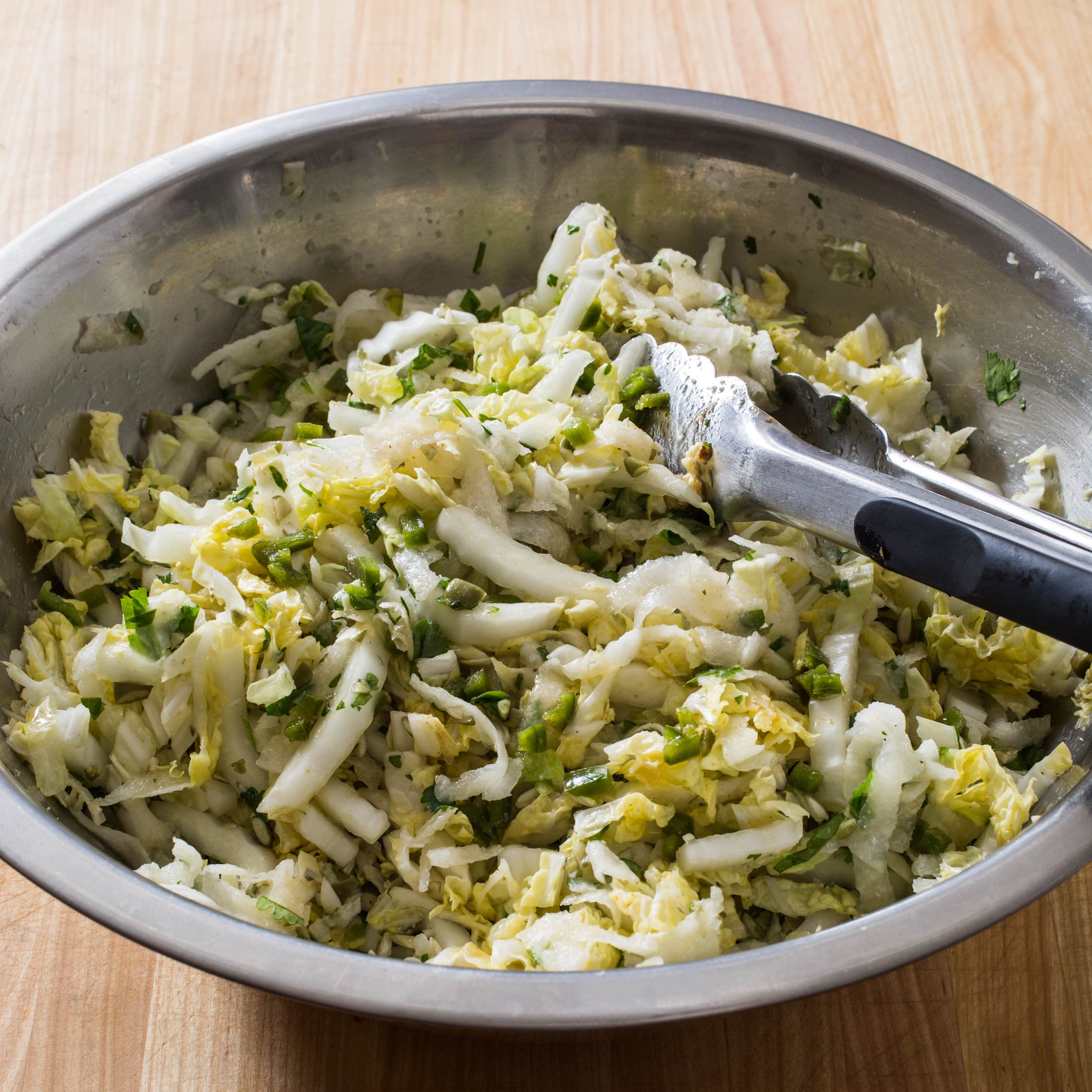 Napa Cabbage Slaw with Jicama and Pepitas | America's Test Kitchen