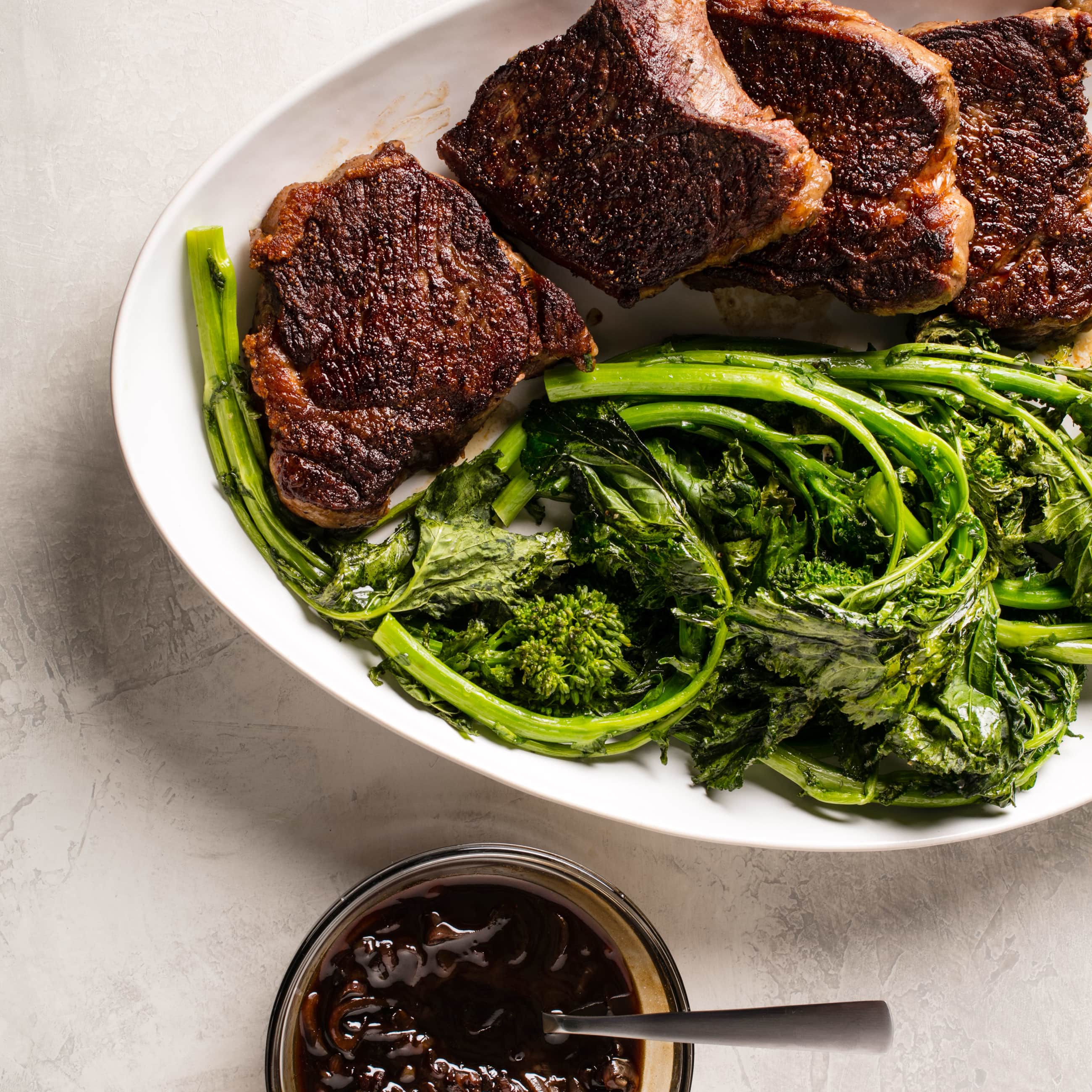 Balsamic-Glazed Strip Steaks with Roasted Broccoli Rabe | America's Test Kitchen
