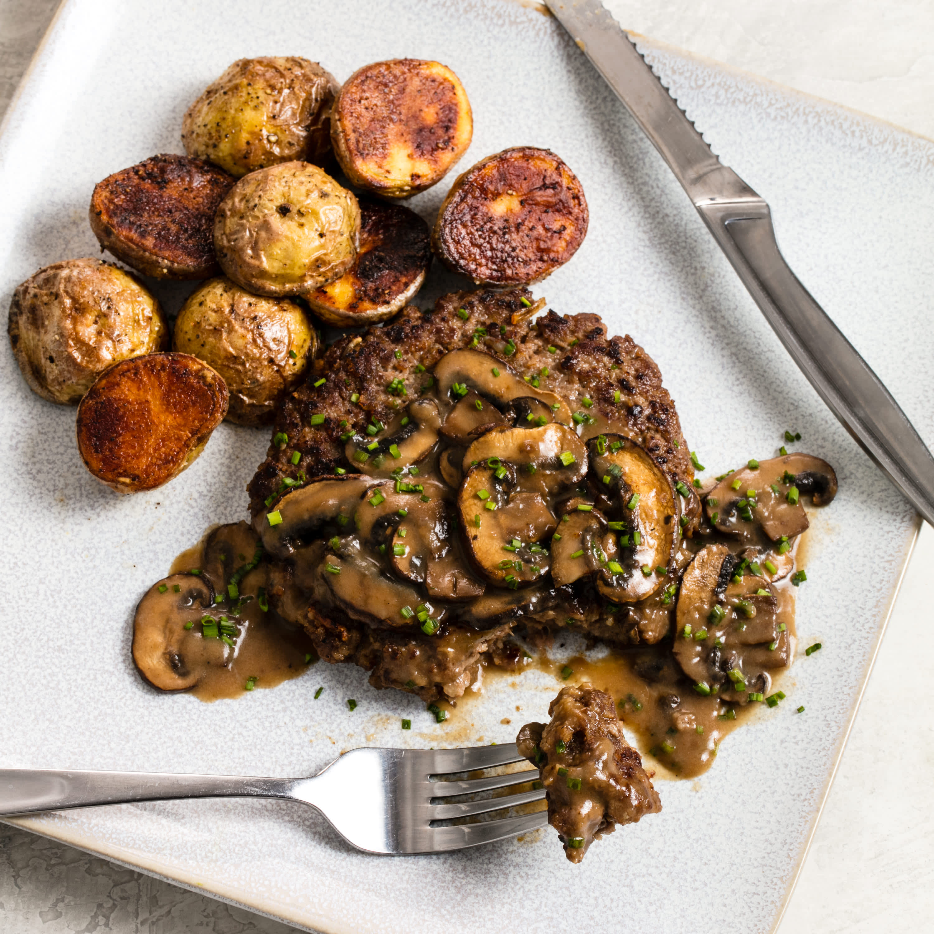 French Onion Hamburger Steaks with Potatoes and Gravy