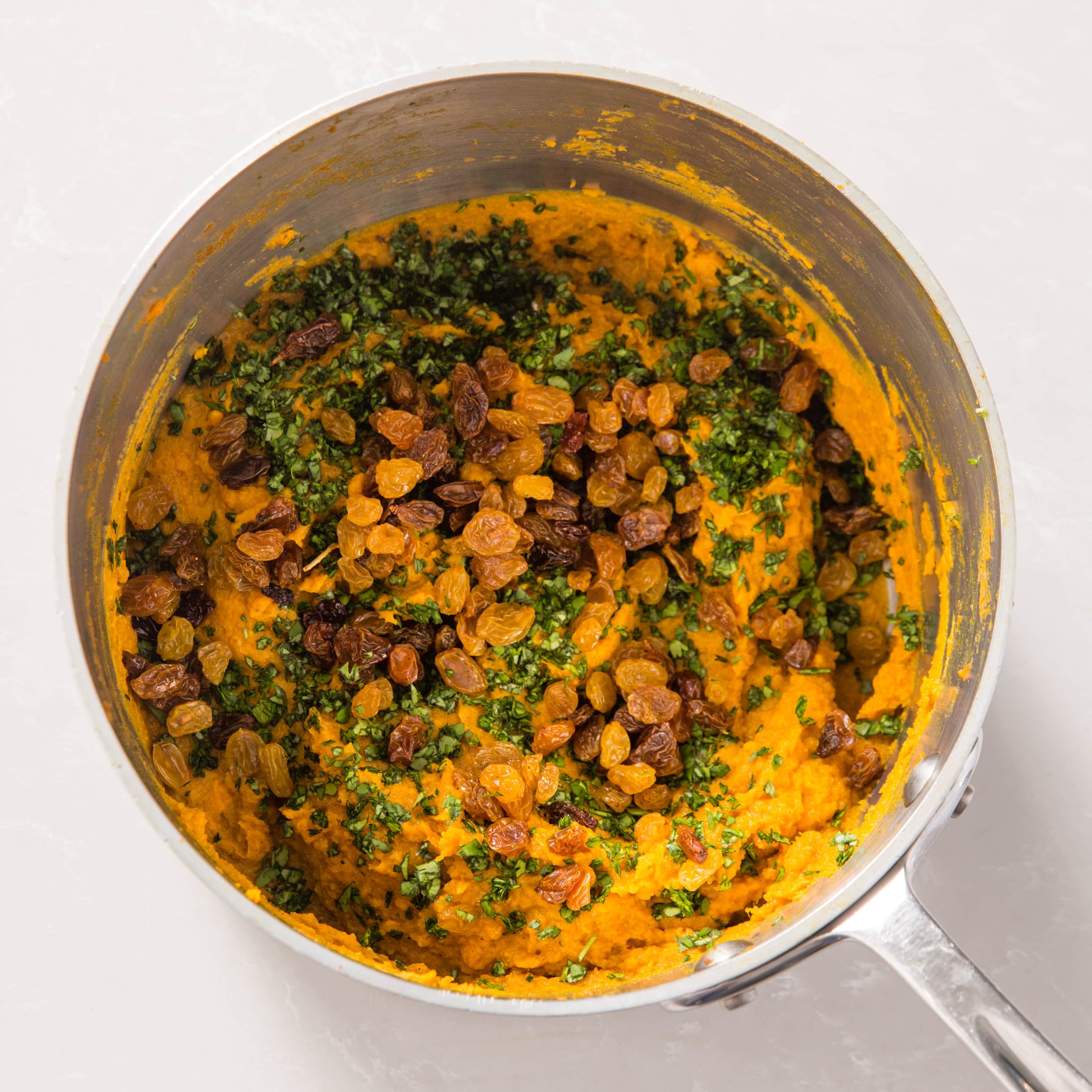 mashed-sweet-potatoes-with-curry-and-golden-raisins