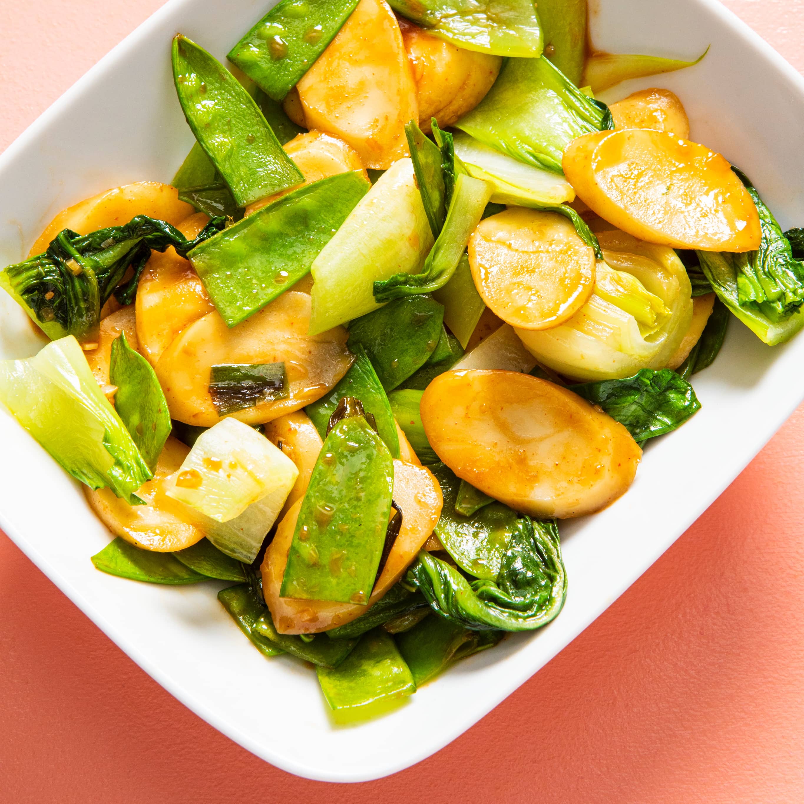 Stir-Fried Rice Cakes with Bok Choy and Snow Peas | America's Test Kitchen