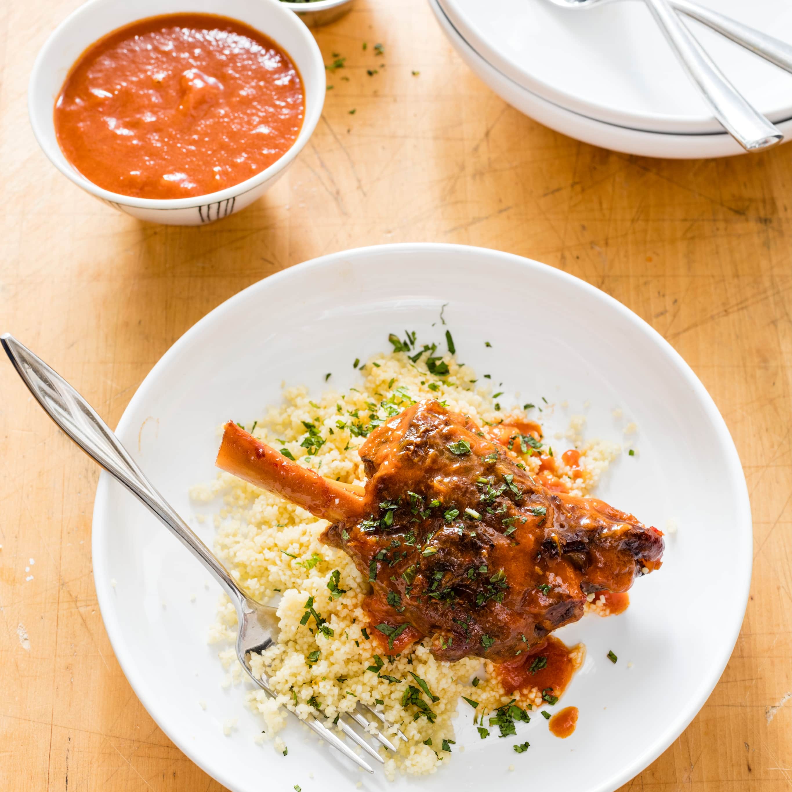 Braised Lamb Shanks with Bell Peppers and Harissa | America's Test Kitchen