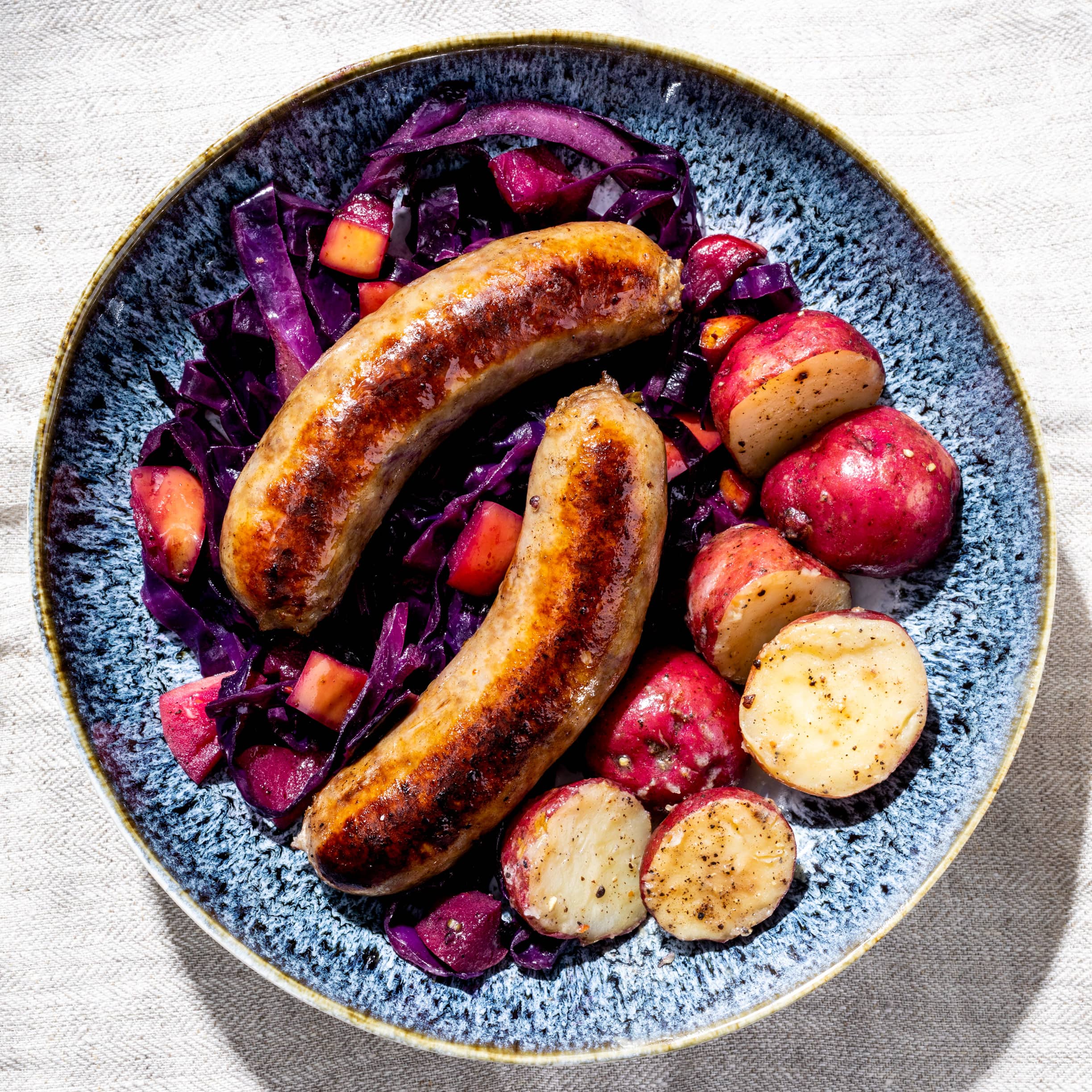 Bratwursts with Braised Red Cabbage and Potatoes