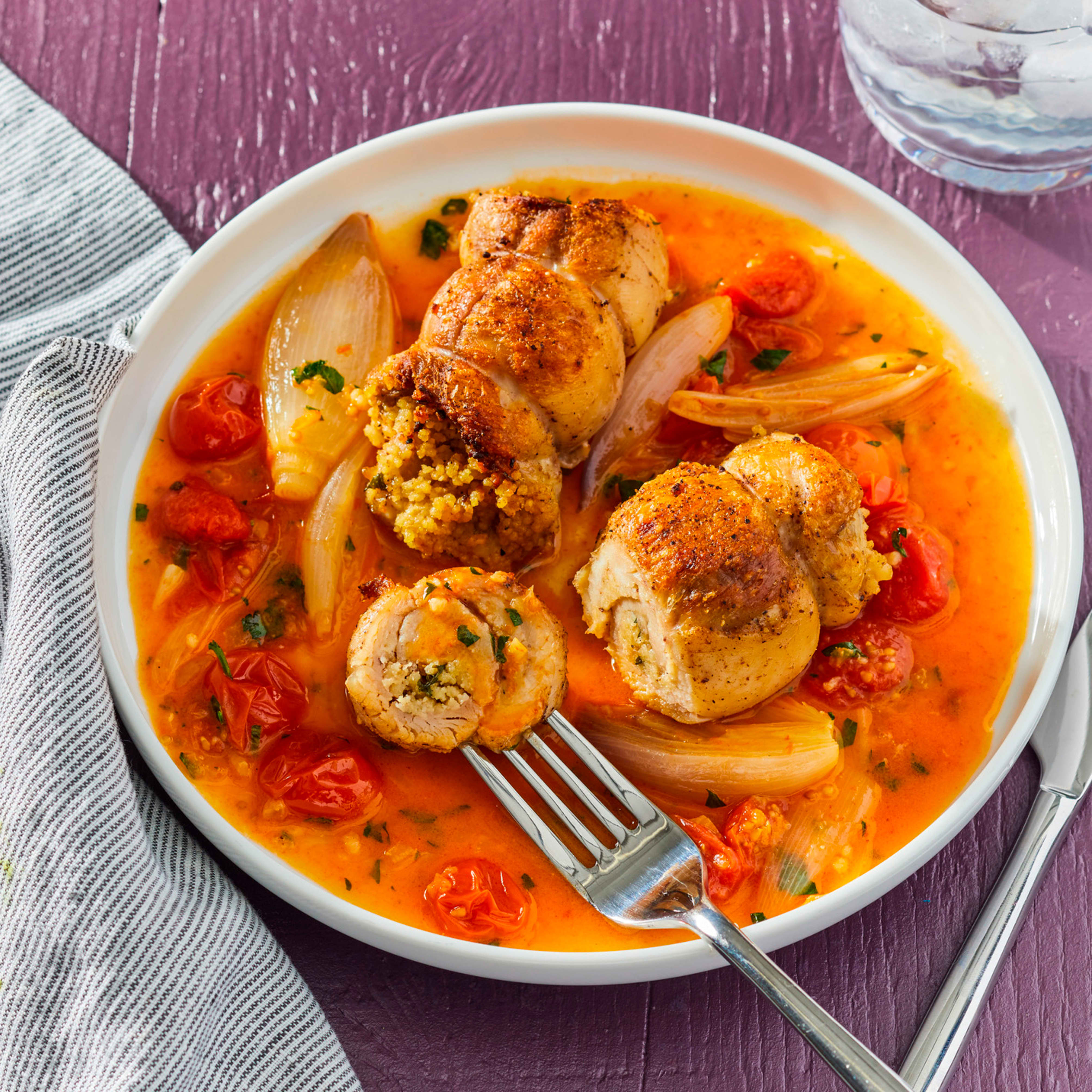 Couscous Stuffed Chicken Thighs with Roasted Cherry Tomatoes and Shallots