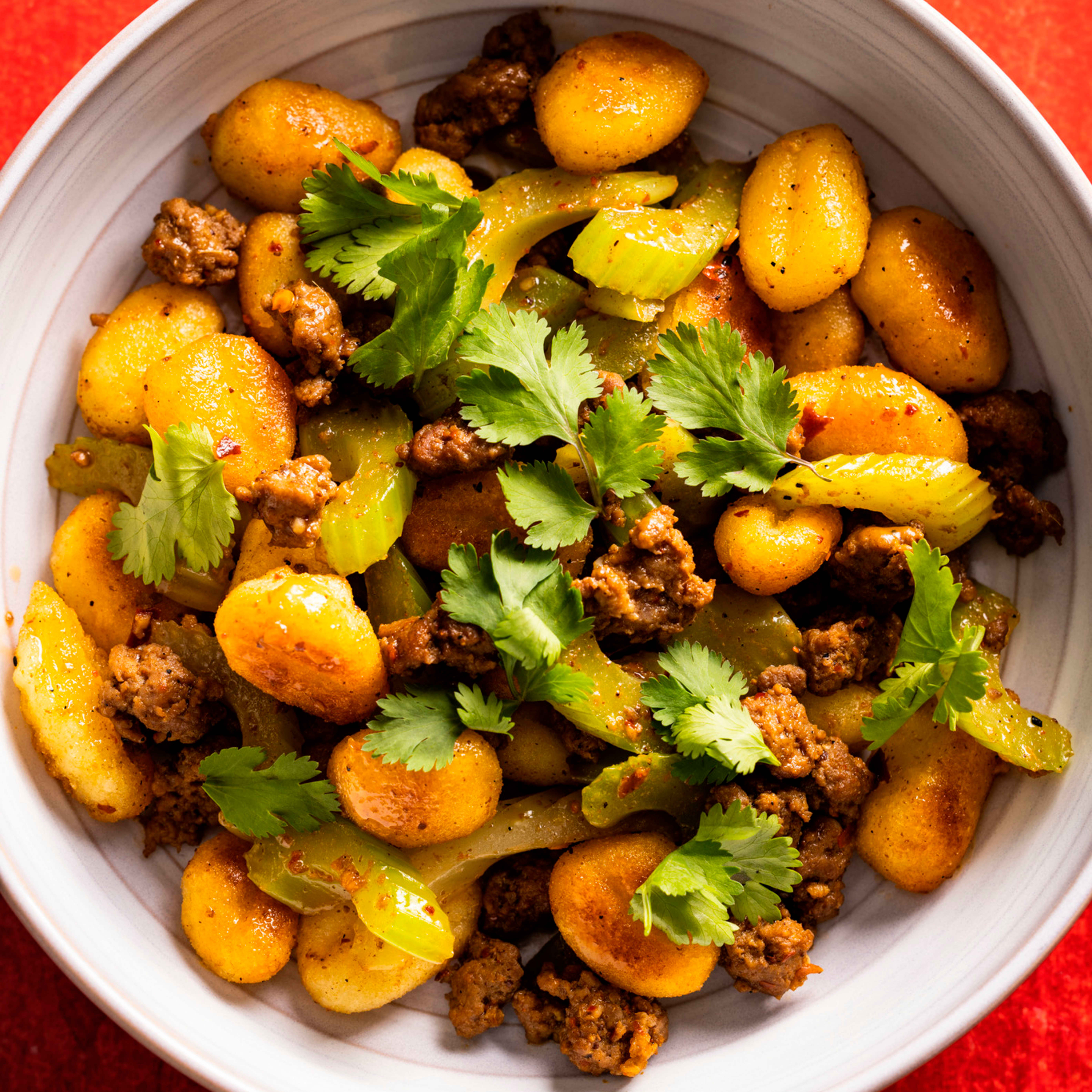 Crispy Pan-Fried Gnocchi with Spicy Cumin Lamb and Celery