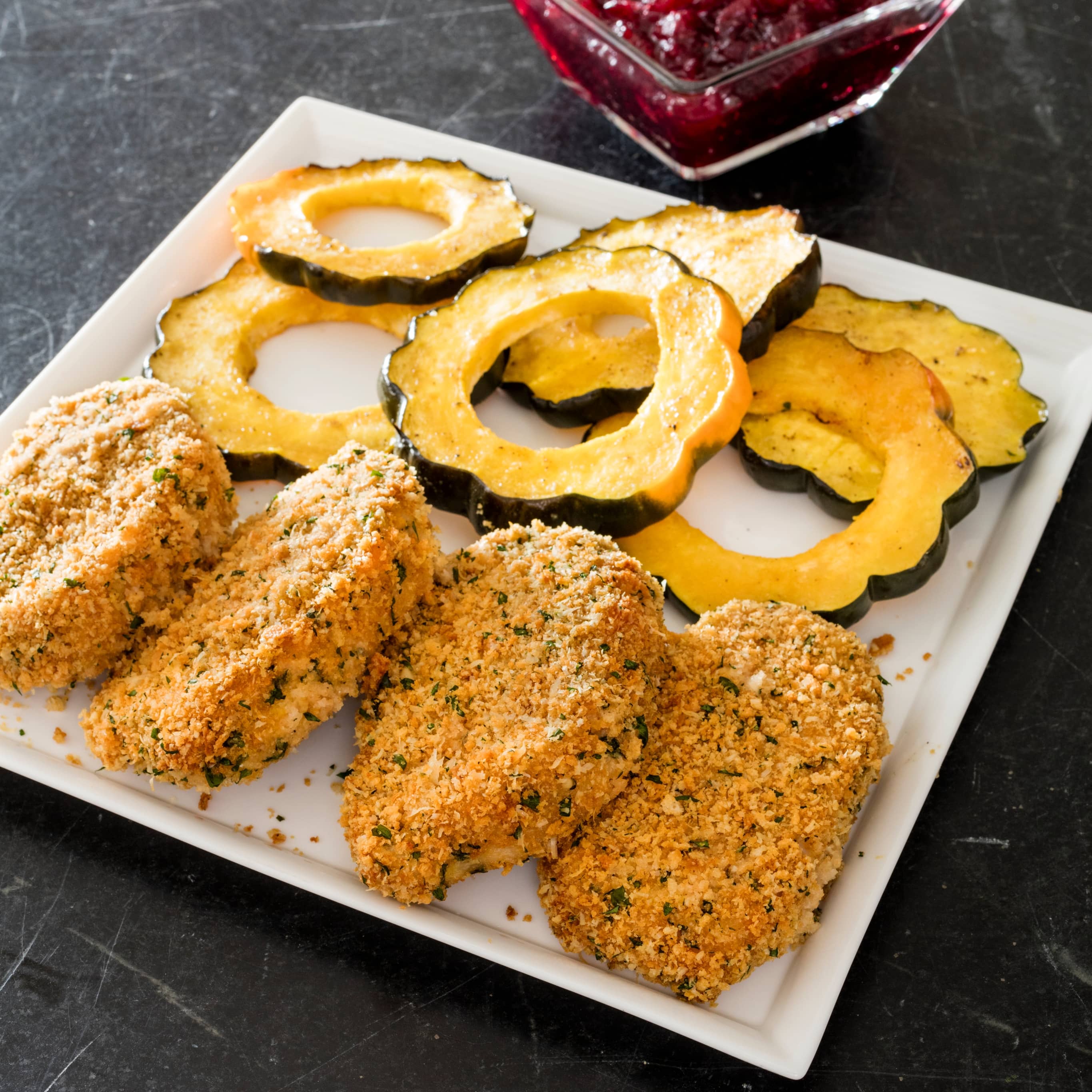 Sheet-Pan Crunchy Parmesan-Crusted Pork Chops with Winter Squash and Cranberry Sauce