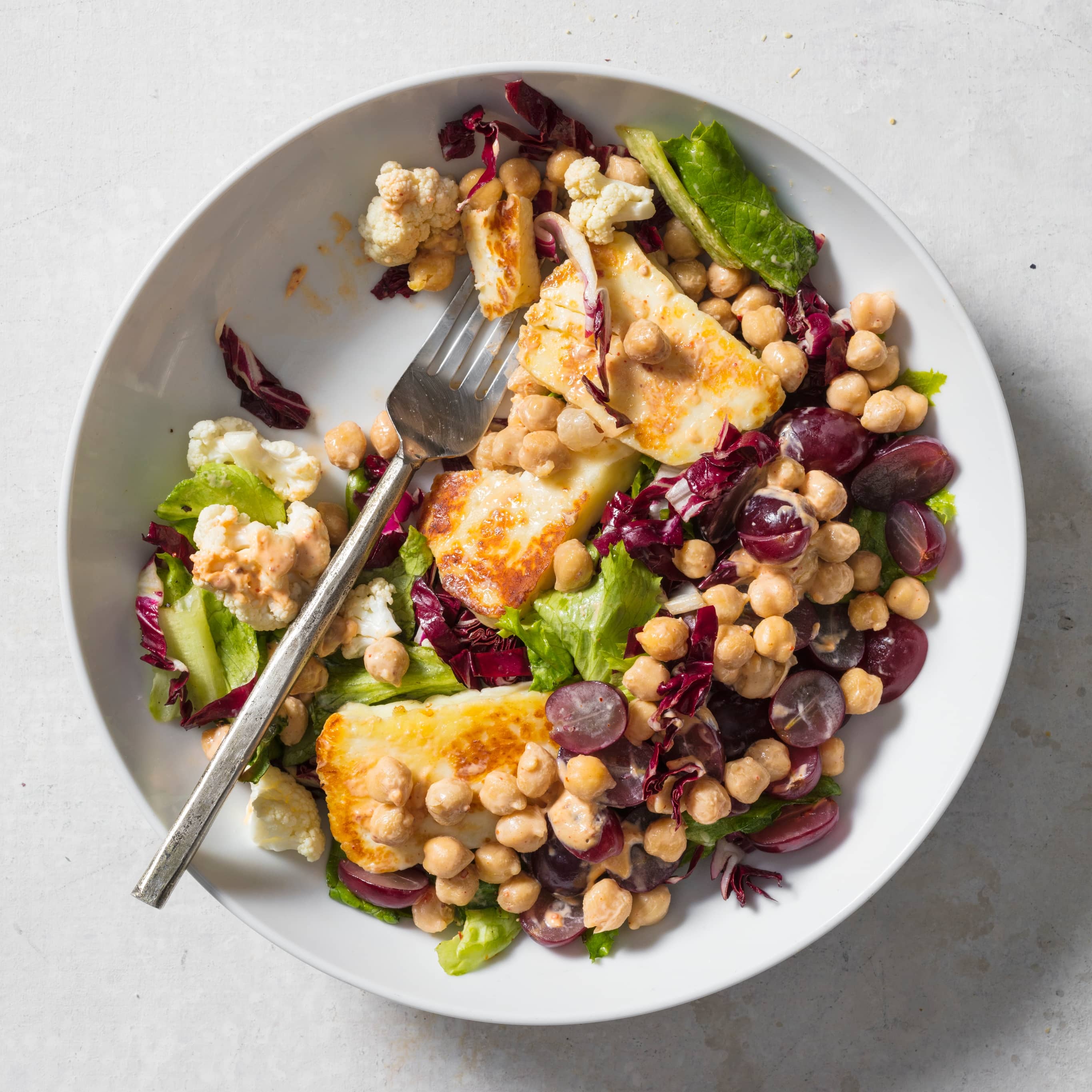 Hearty Green Salad with Chickpeas, Pickled Cauliflower, and Seared Halloumi | America's Test Kitchen
