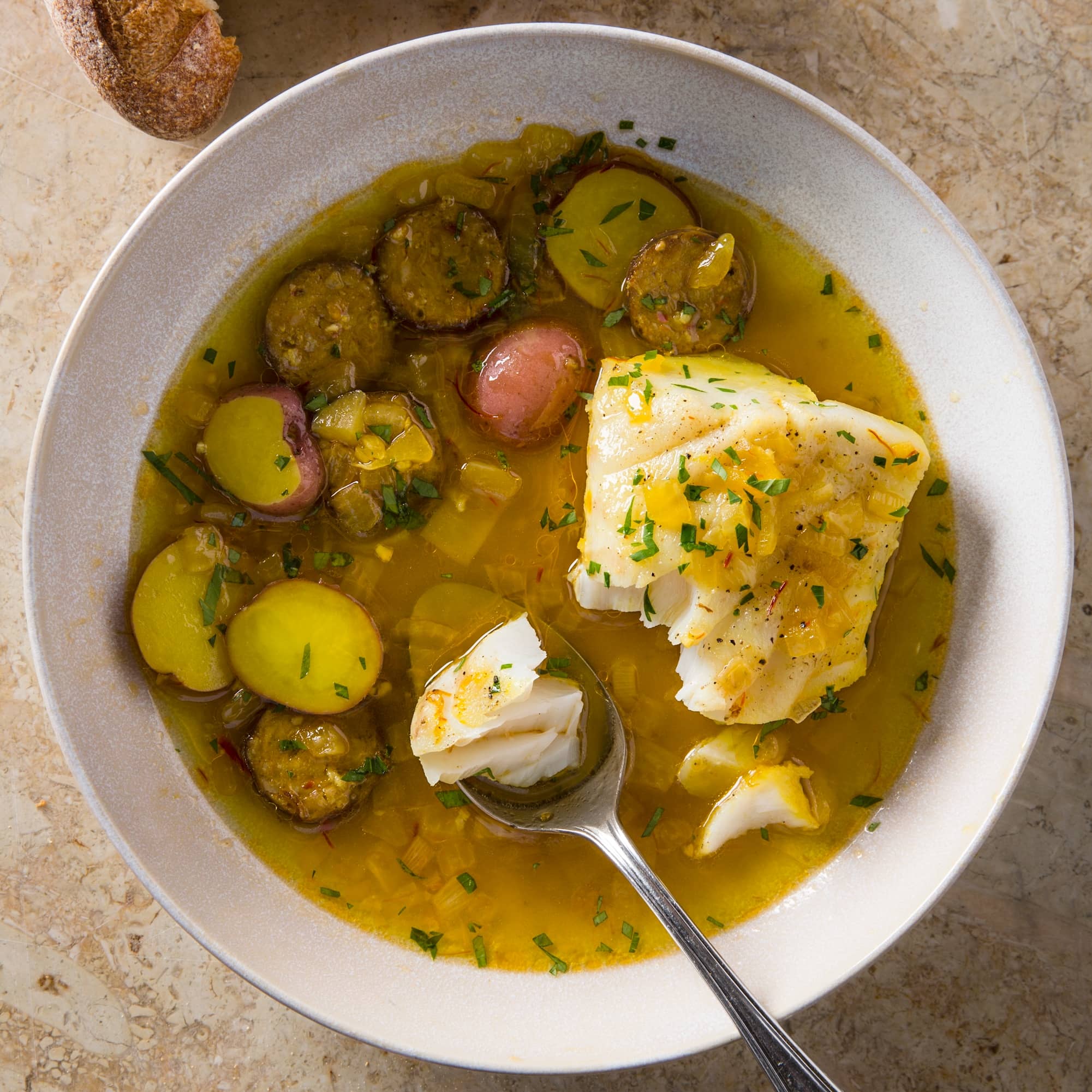 Hake in Saffron Broth with Chorizo and Potatoes | America's Test Kitchen