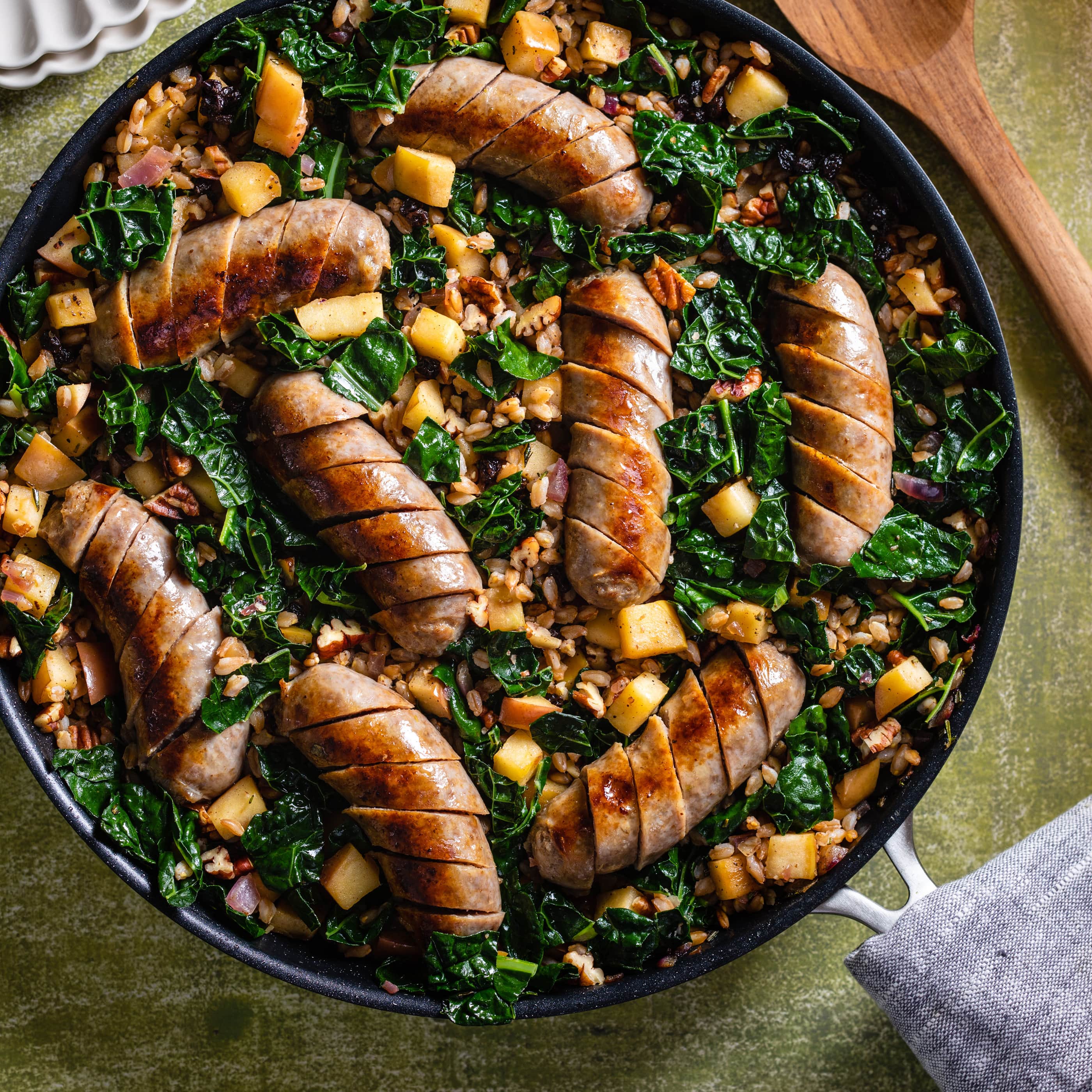 Italian Sausages with Farro and Kale Pilaf | America's Test Kitchen