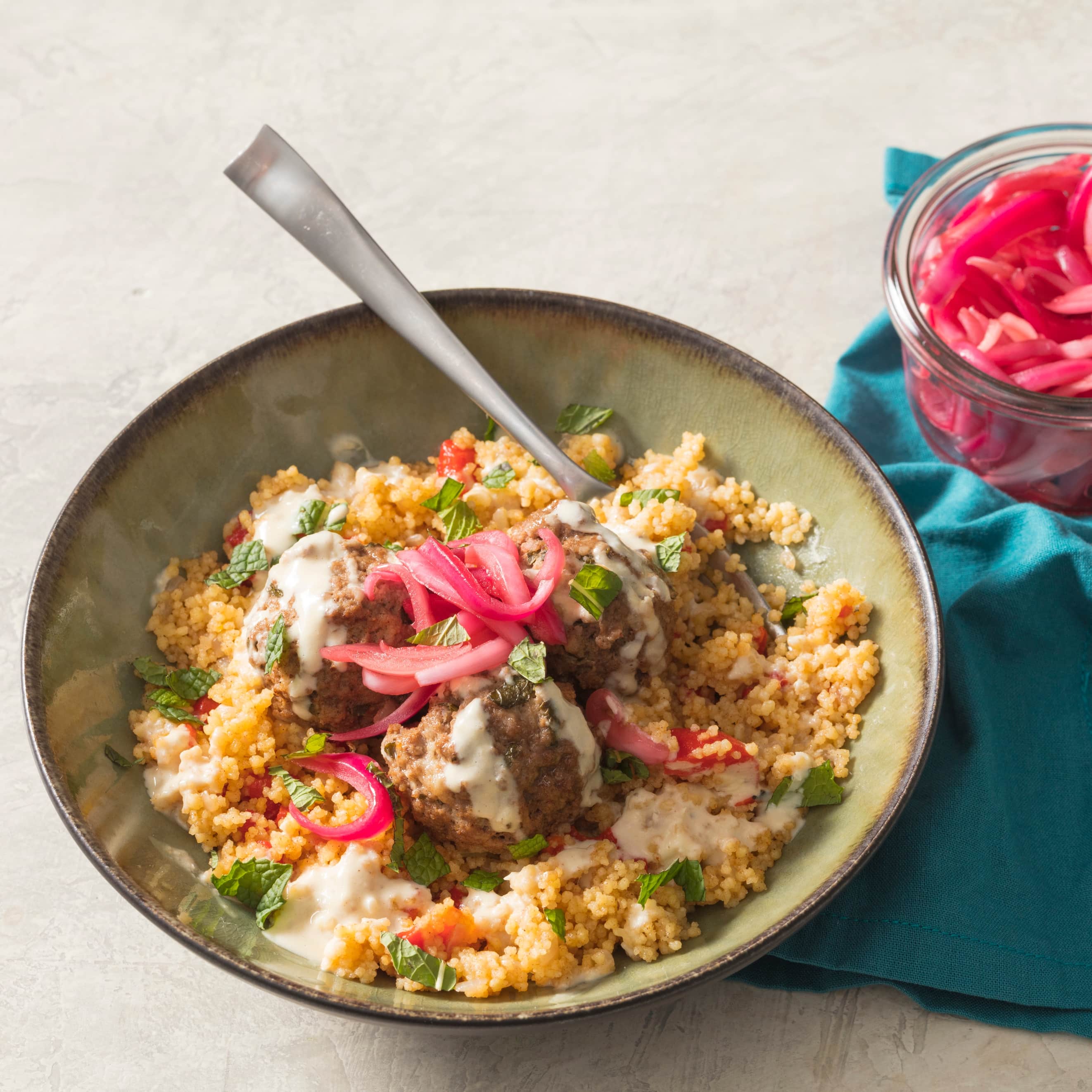Instant Pot Lamb Meatballs with Couscous, Pickled Onions, and Tahini