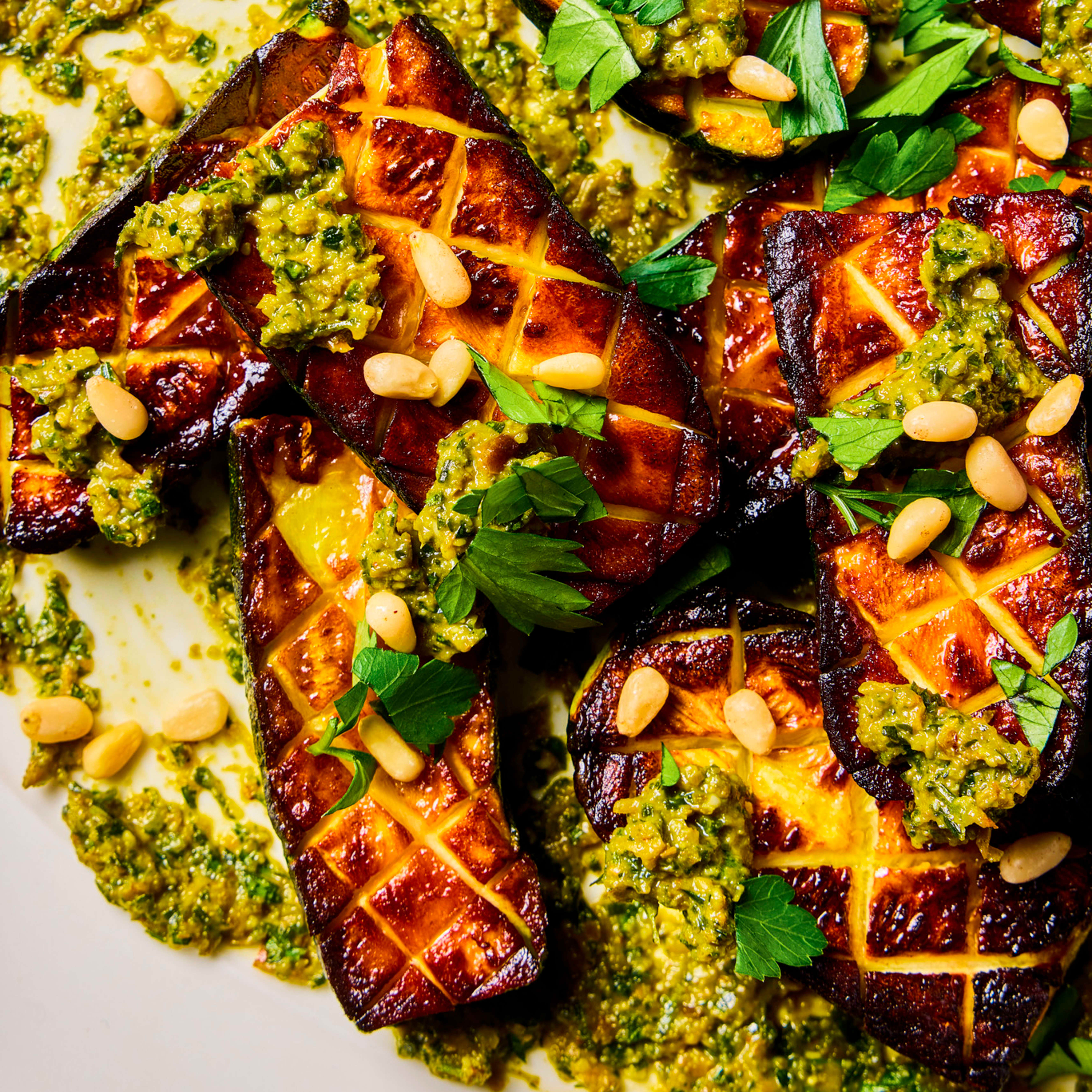 Pan-Seared Zucchini with Raisin, Caper, and Parsley Sauce and Pine Nuts