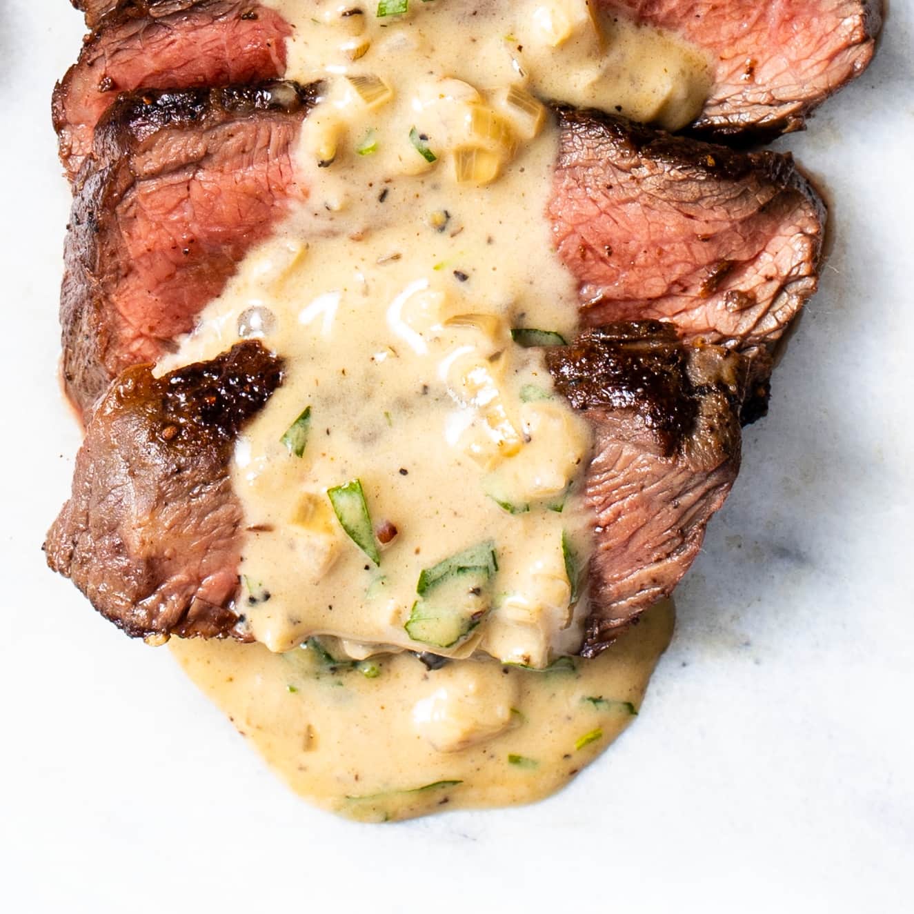 Pan-Seared Sirloin Steaks with Creamy Black Pepper-Tarragon Pan Sauce | America's Test Kitchen
