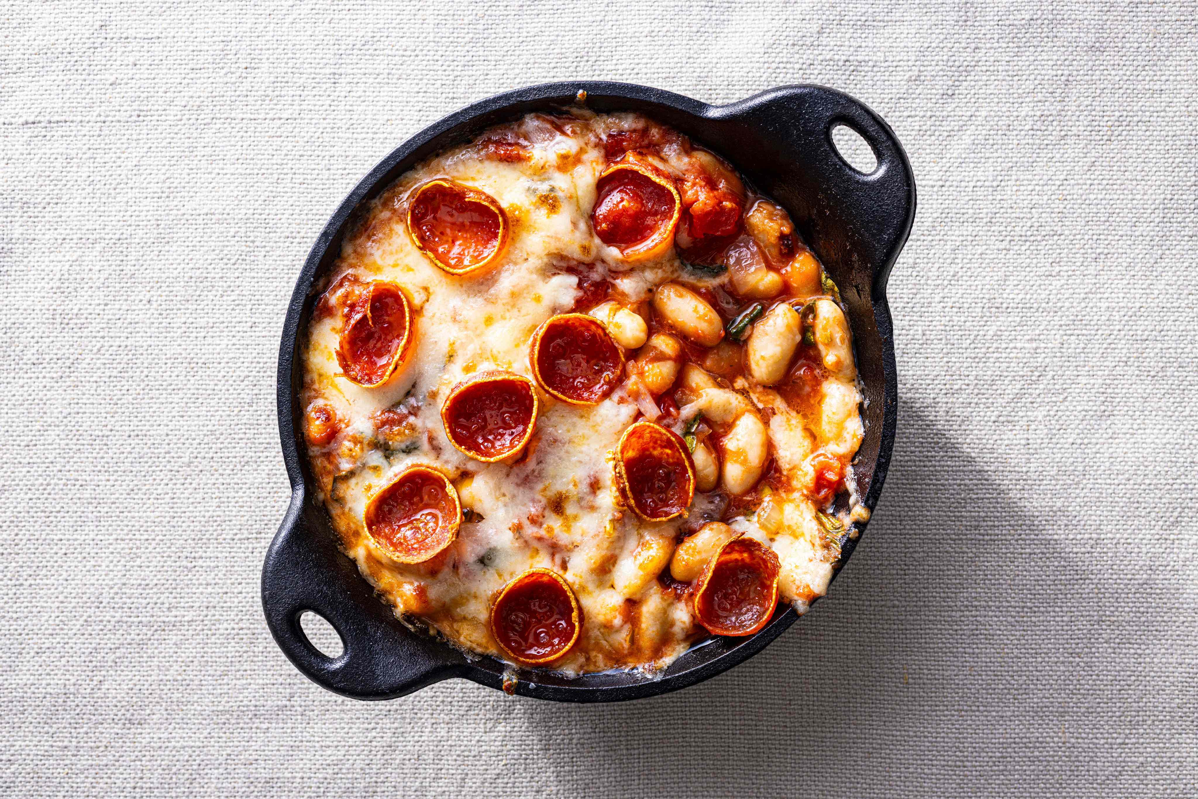 Pepperoni pizza beans in a cast-iron skillet