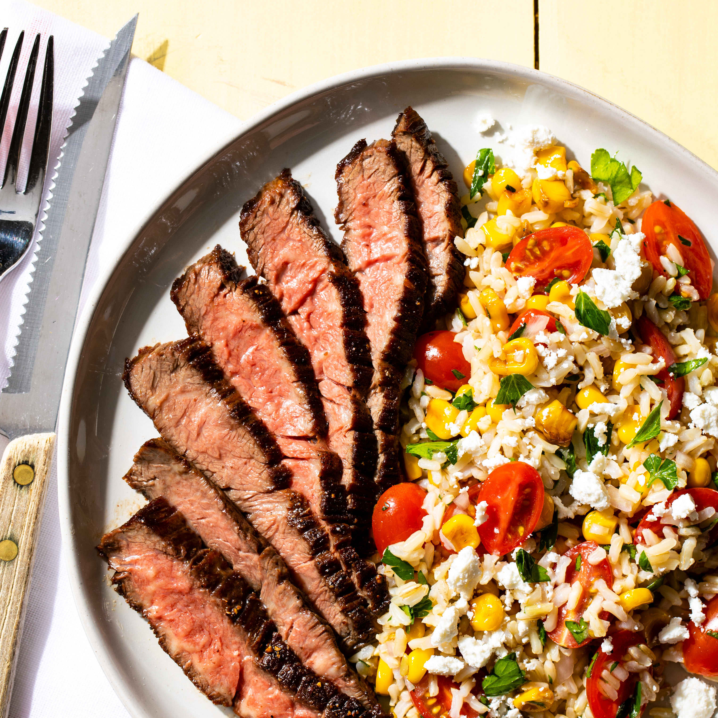 Skirt Steak with Tomato, Corn, and Brown Rice Salad | America's Test Kitchen