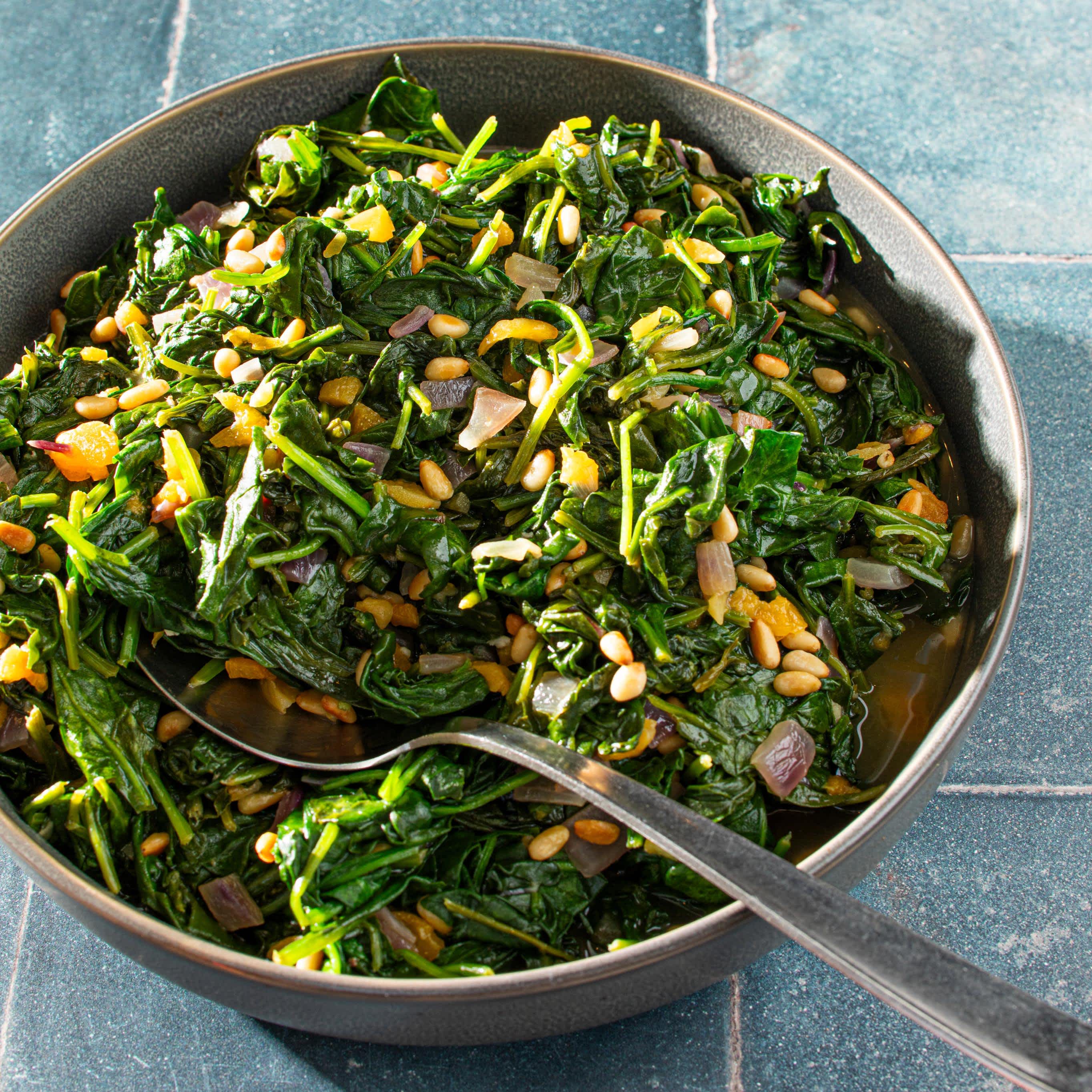 Spinach with Caramelized Onions, Pine Nuts, and Dried Apricots | America's Test Kitchen