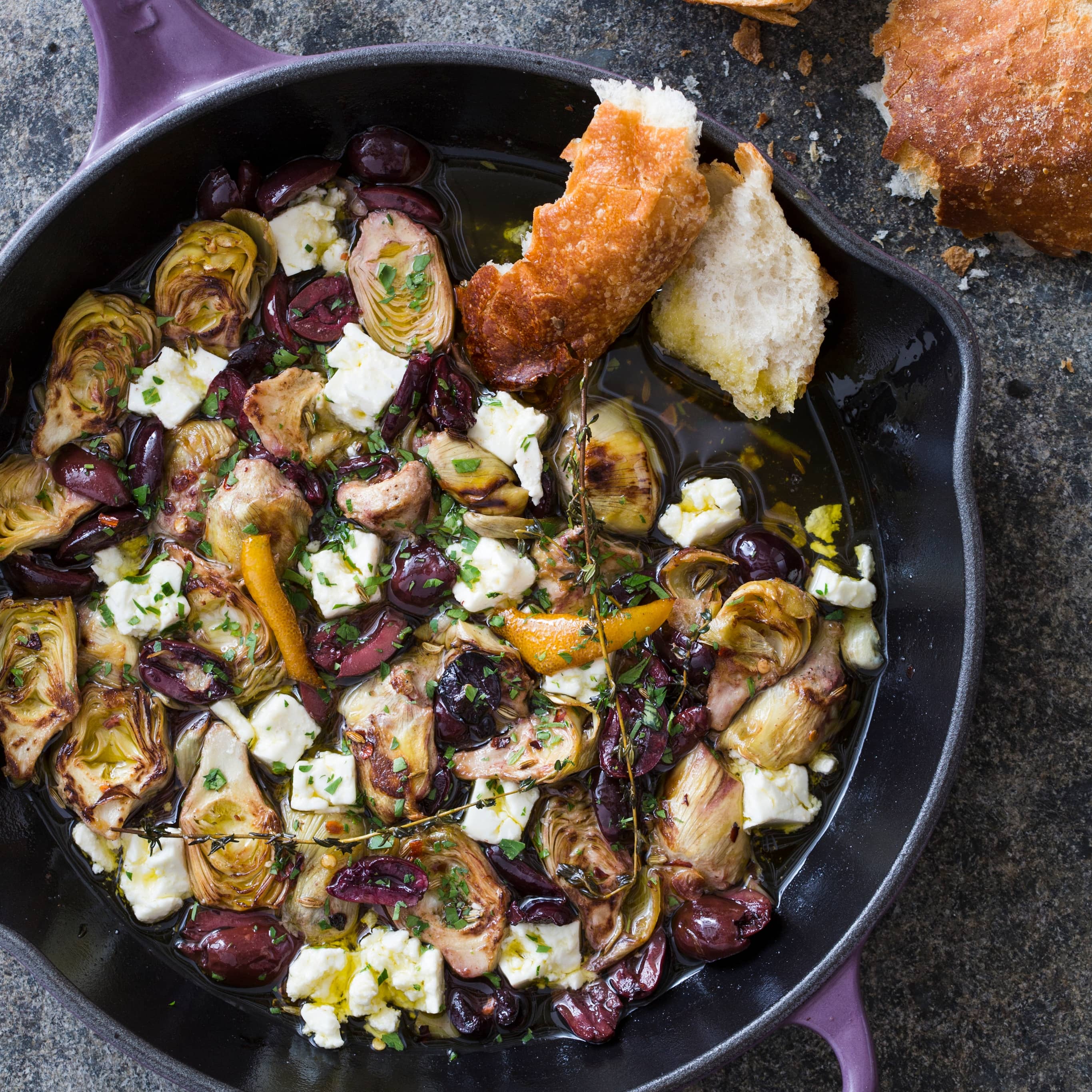 Cast Iron Warm Marinated Artichoke Hearts with Olives and Feta | America's Test Kitchen