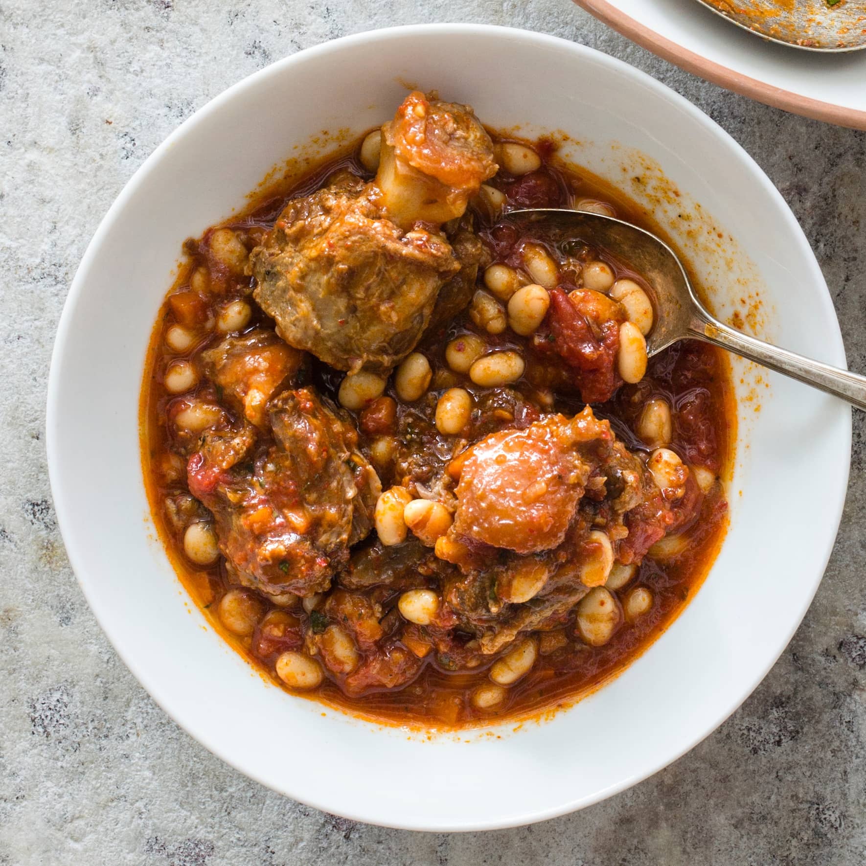 Braised Oxtails with White Beans, Tomatoes, and Aleppo Pepper
