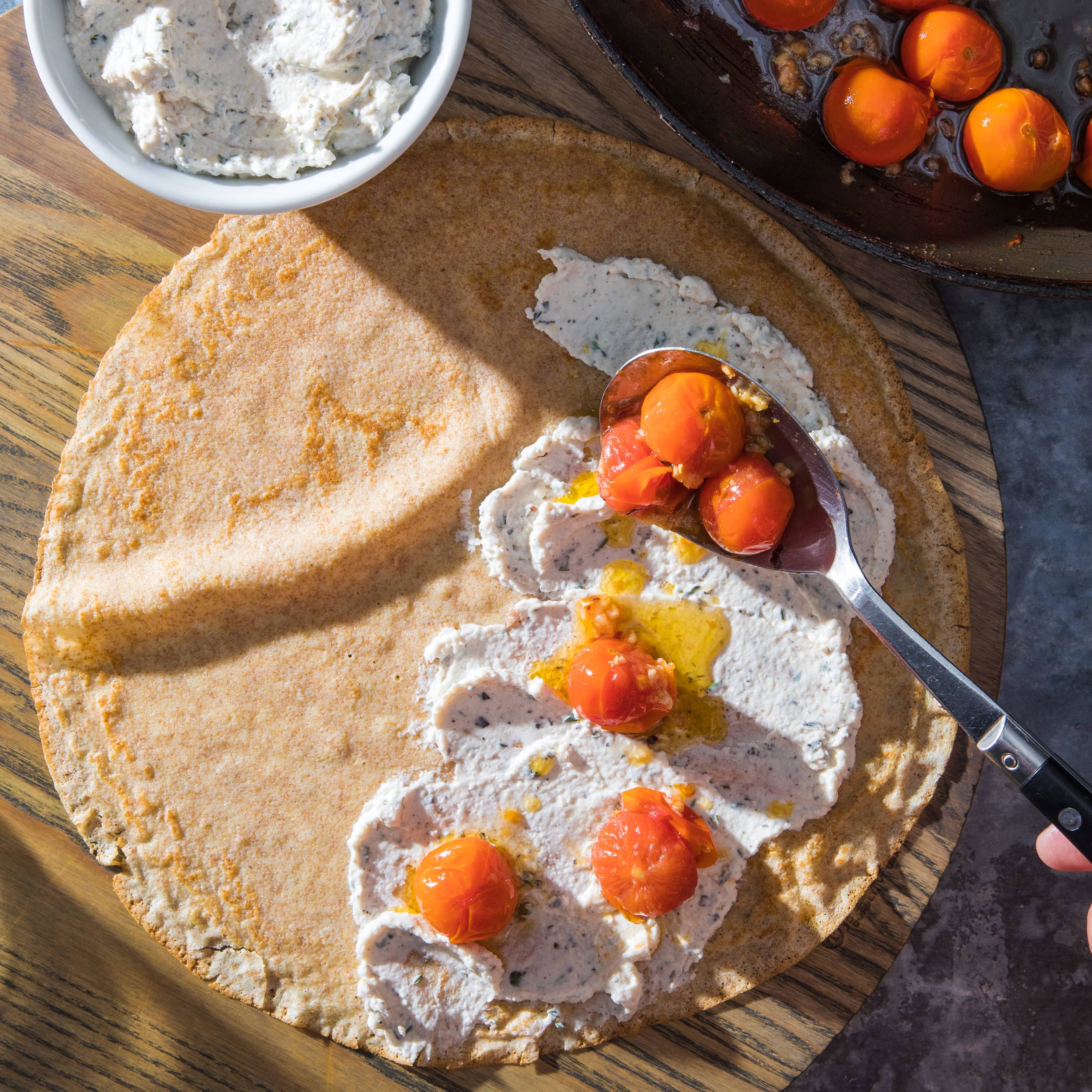 Whole-Wheat Crepes with Sautéed Cherry Tomatoes and Ricotta | America's Test Kitchen