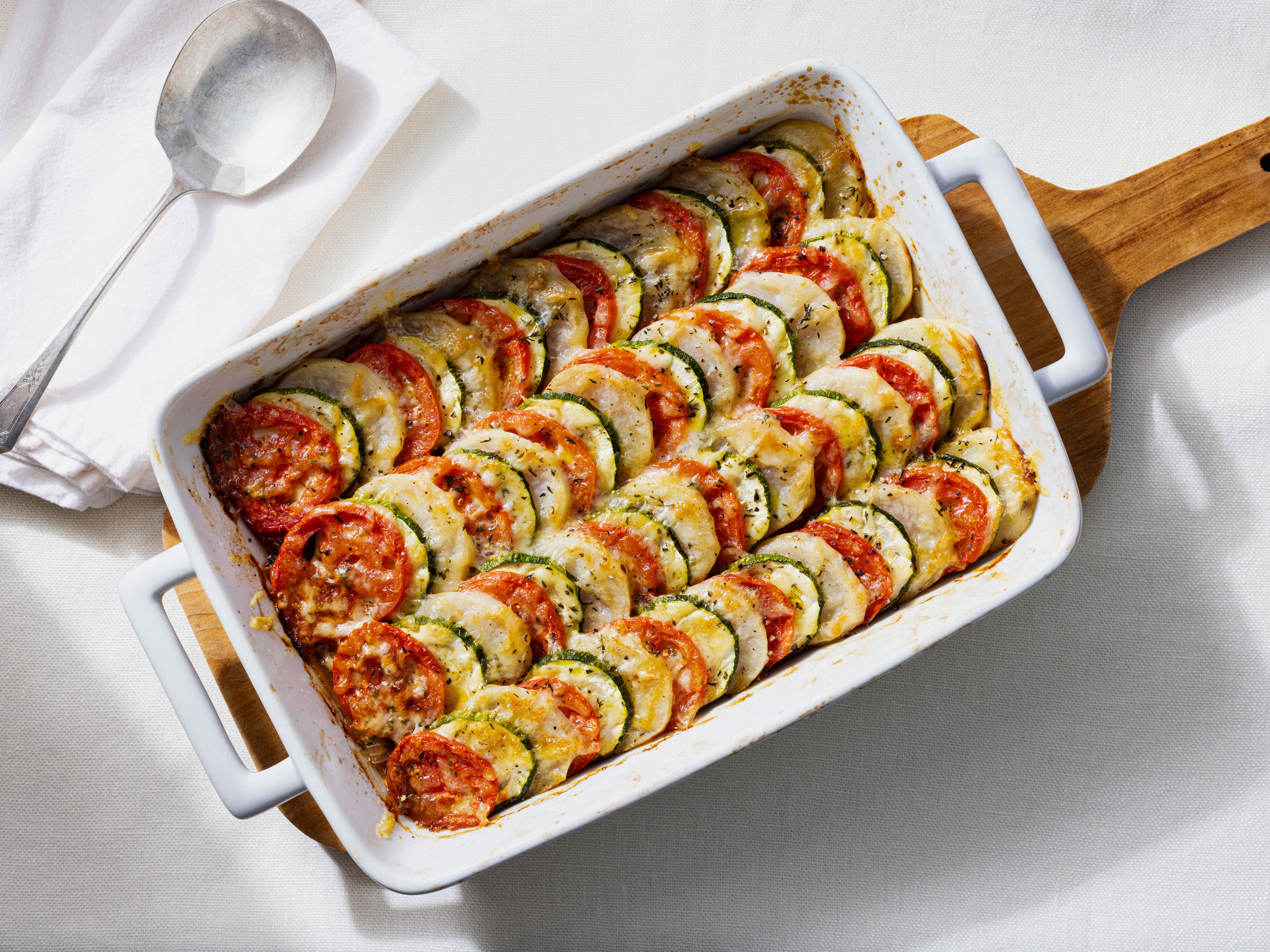 Zucchini, Tomato, and Potato Tian with Caramelized Onions | America's Test Kitchen