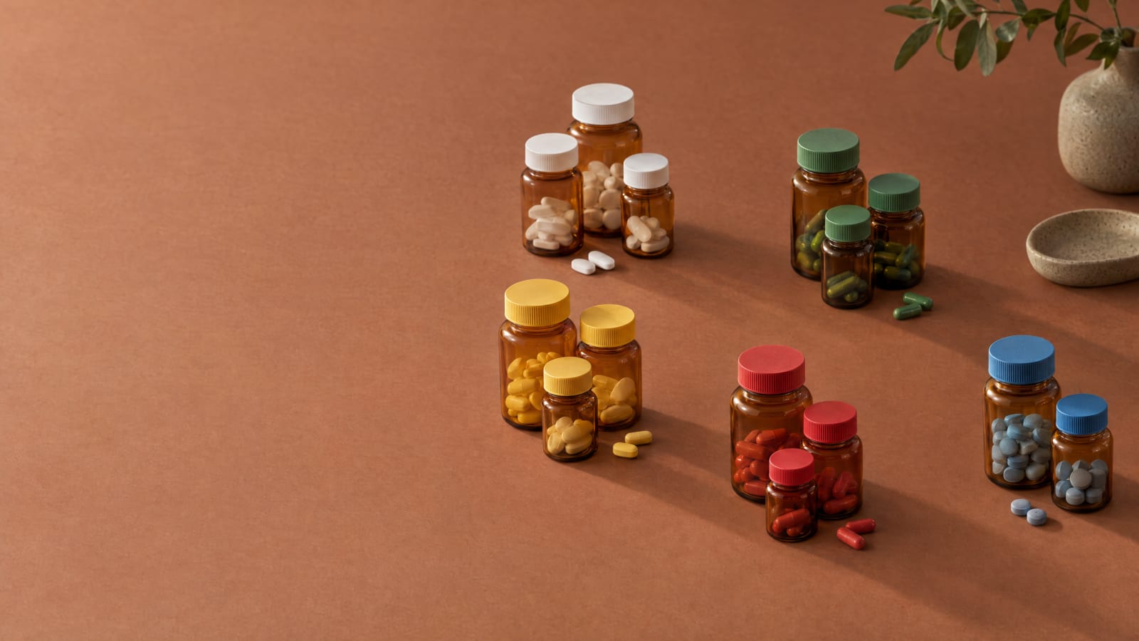 Groups of pill bottles, each group with matching caps.