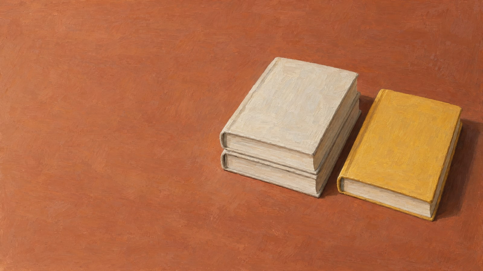 Two stacked identical book blocks beside a single different block.
