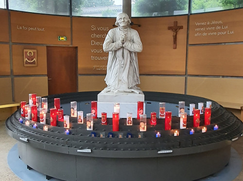 Light a candle for a priest
