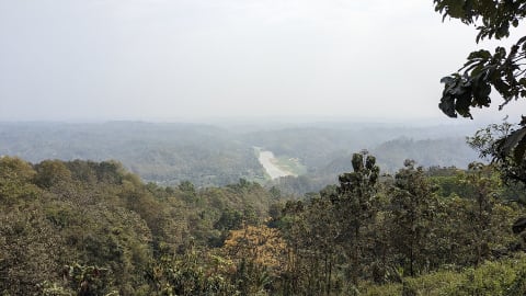 Forested hills and a river valley seen from Nilgiri