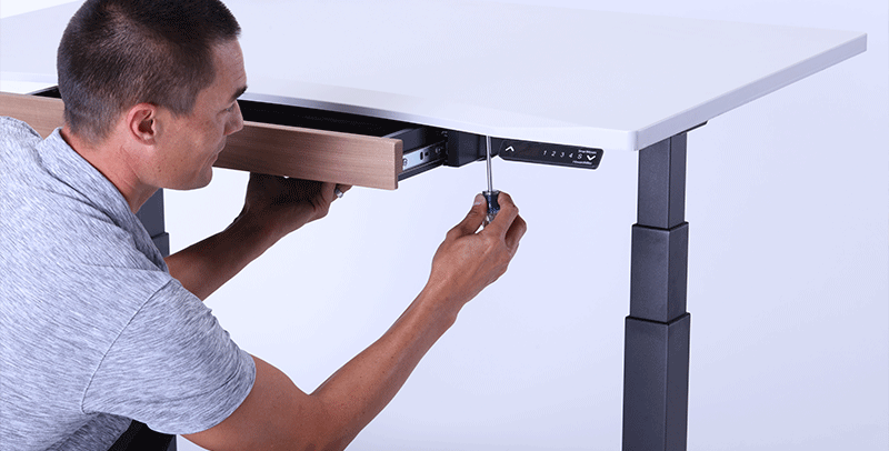 Man Assembling SmartMoves Adjustable Height Desk