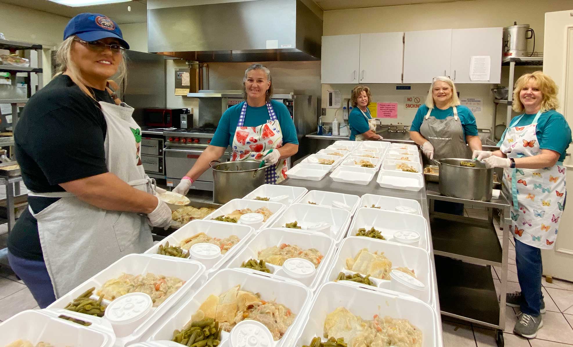 volunteers preparing meals