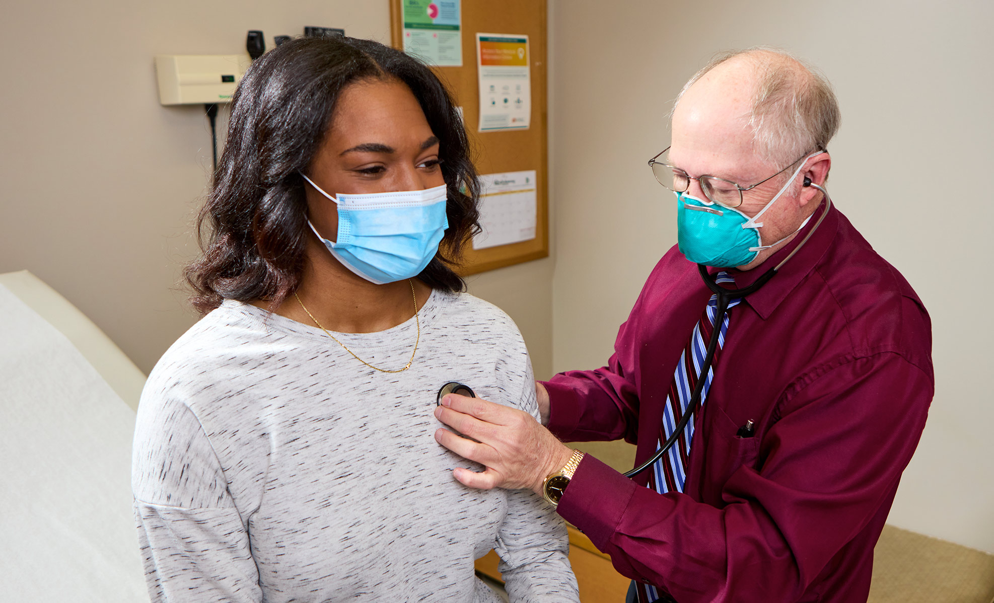 doctor checking a patient's heart