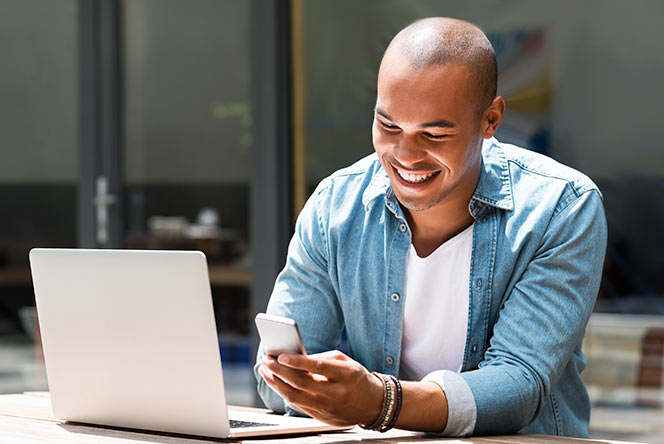 Man using myHMG on his cell phone