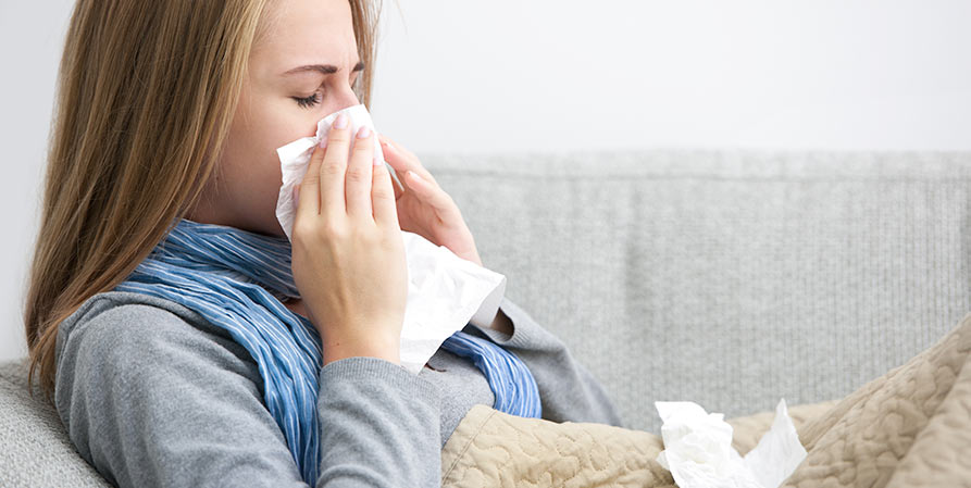 girl blowing her nose