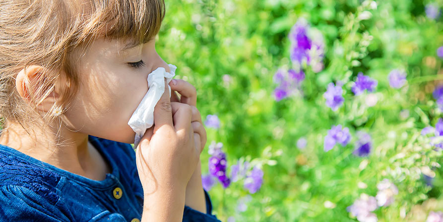 girl blowing her nose