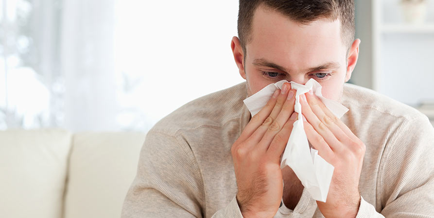 guy blowing his nose