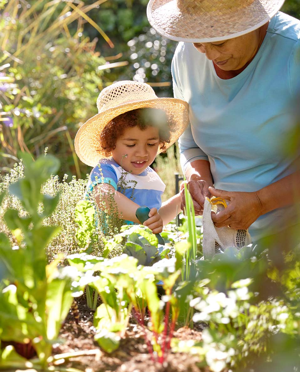 Wearing summer hats while gardening