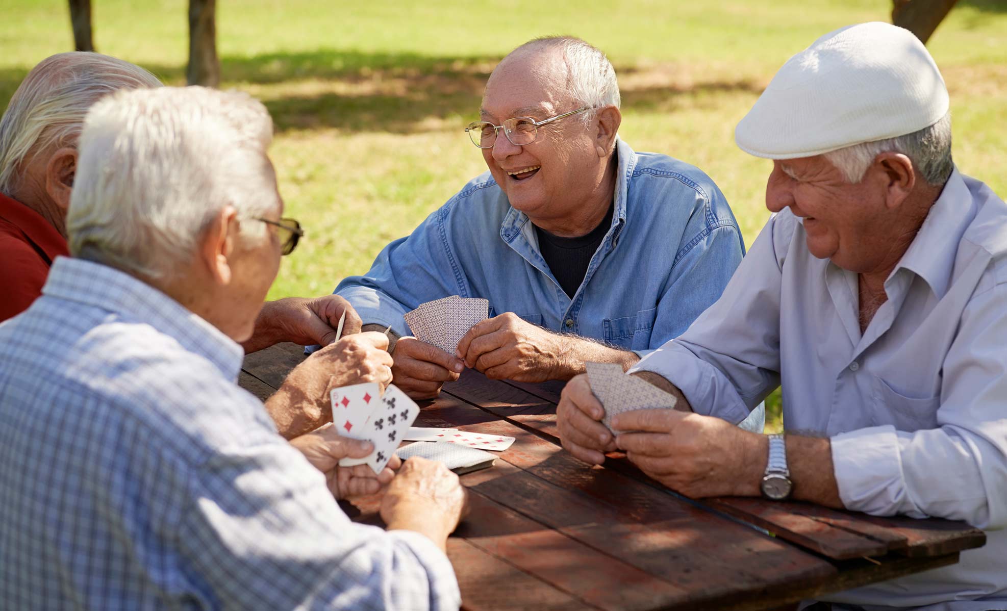 Senior group playing cards