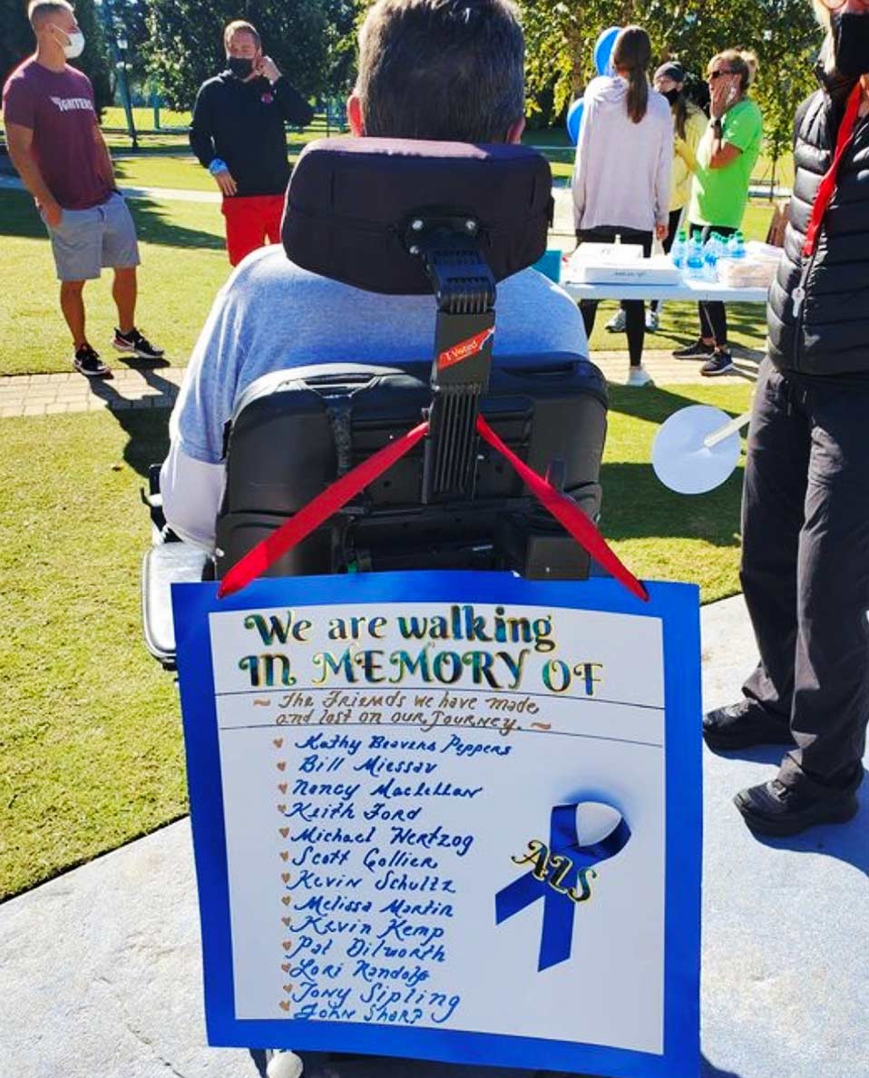 sign on the back of a wheelchair, remembering those with ALS sign remembering those with ALS