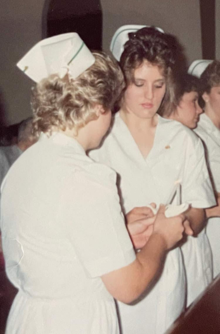 Barsha Grant at graduation in nurse white